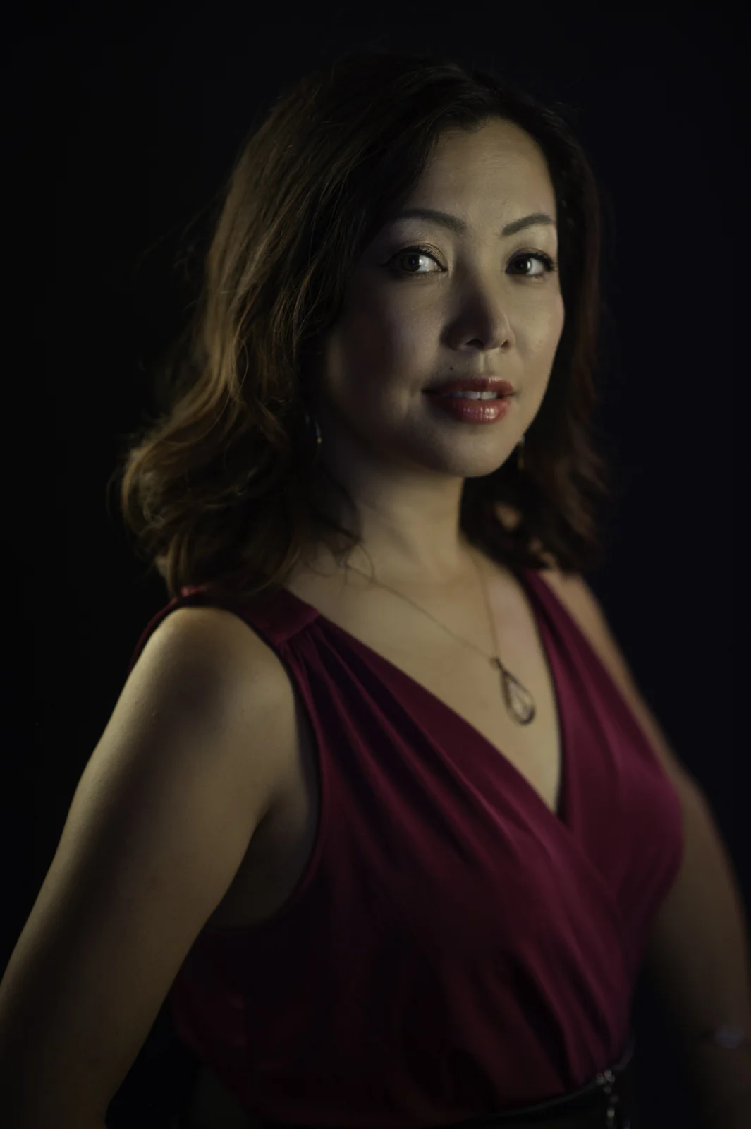 A studio portrait headshot of Keiko Komaki. Image by New Orleans based portrait photographer, Marc Pagani