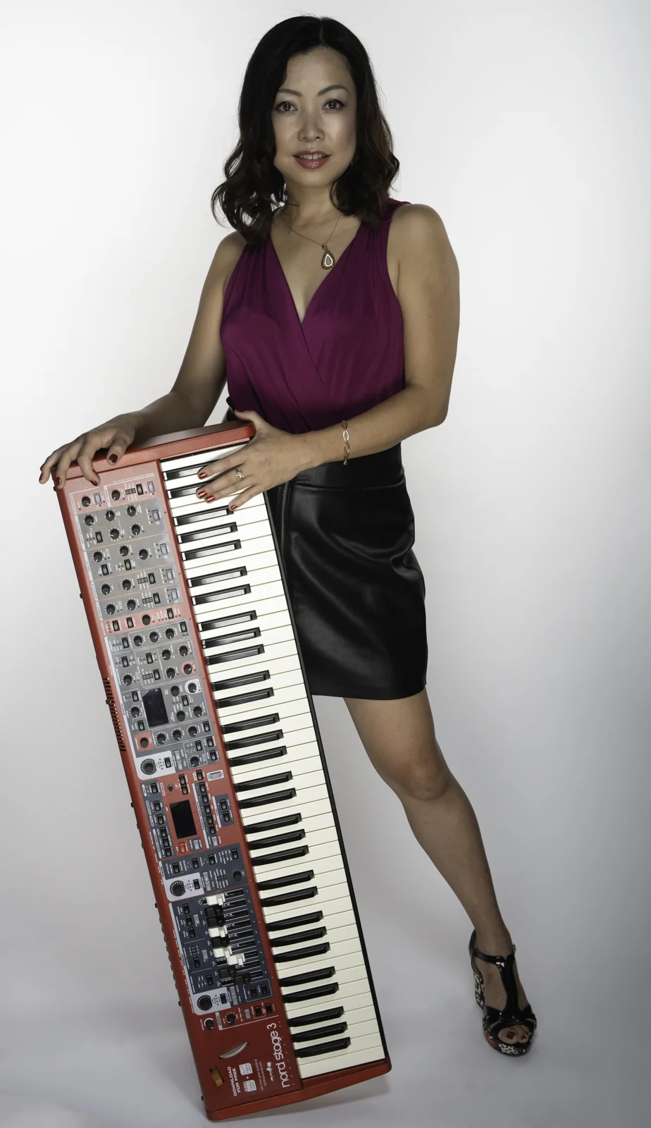 A studio portrait headshot of Keiko Komaki. Image by New Orleans based portrait photographer, Marc Pagani