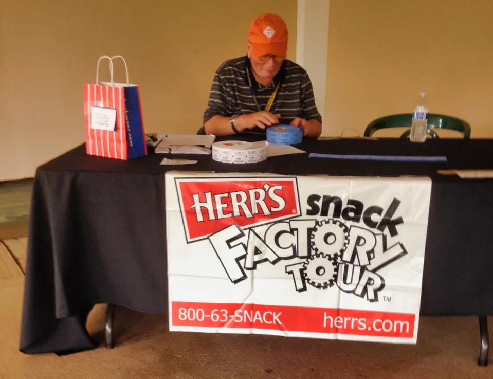 John  At Raffle Table.jpeg