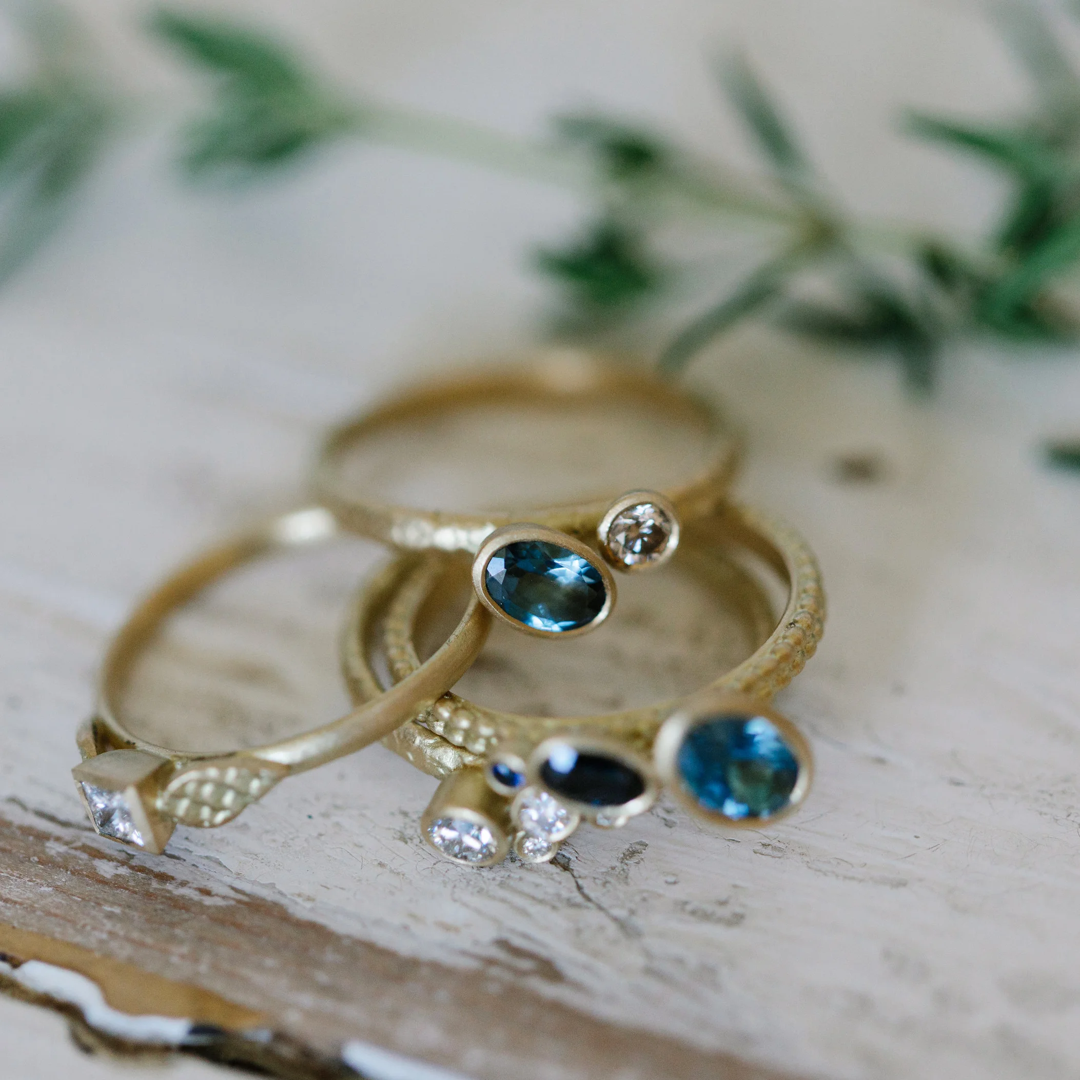 11 Catkin off-set aquamarine and champagne diamond ring in group.jpg