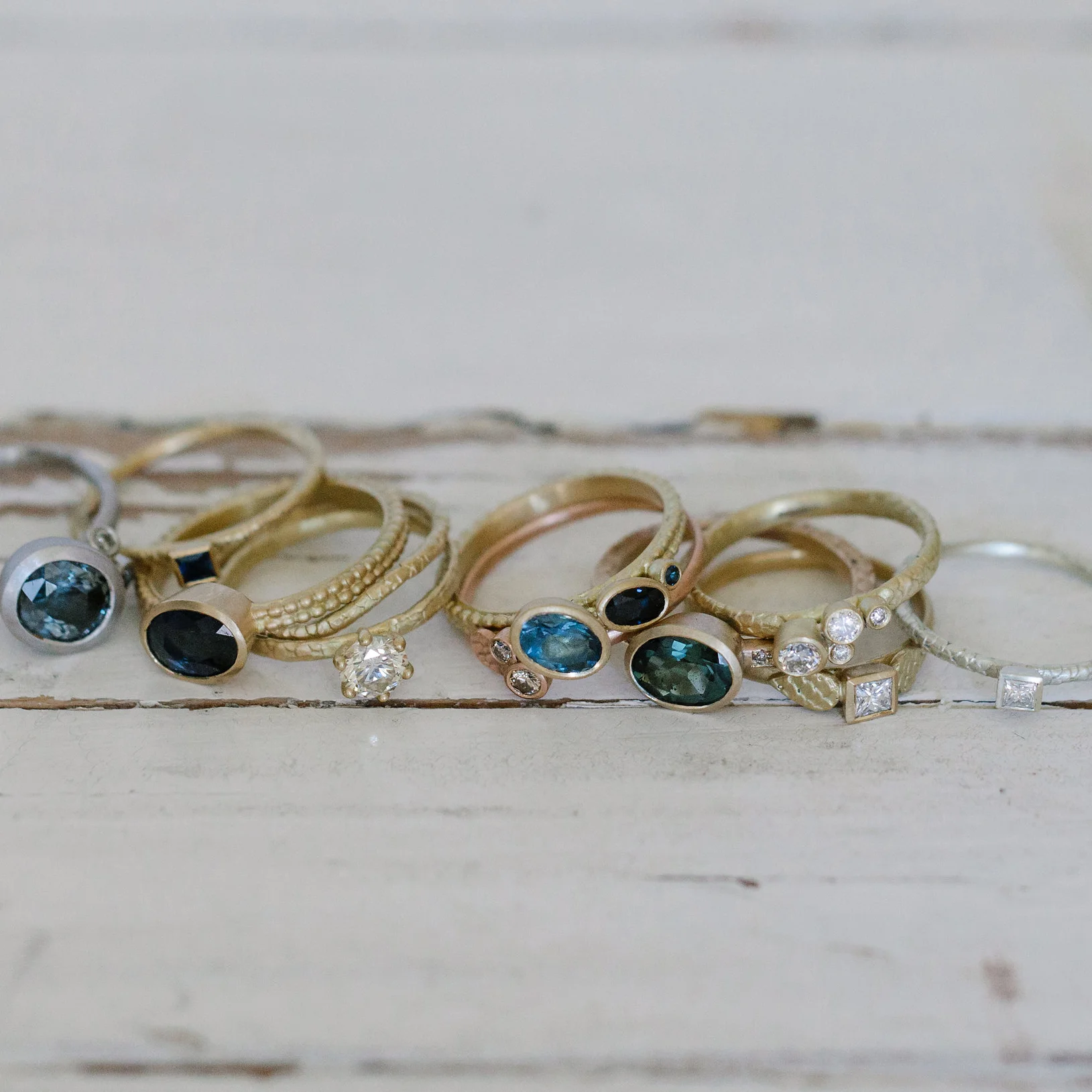 33 off-set aquamarine and sapphire coupled dotty ring in group.jpg