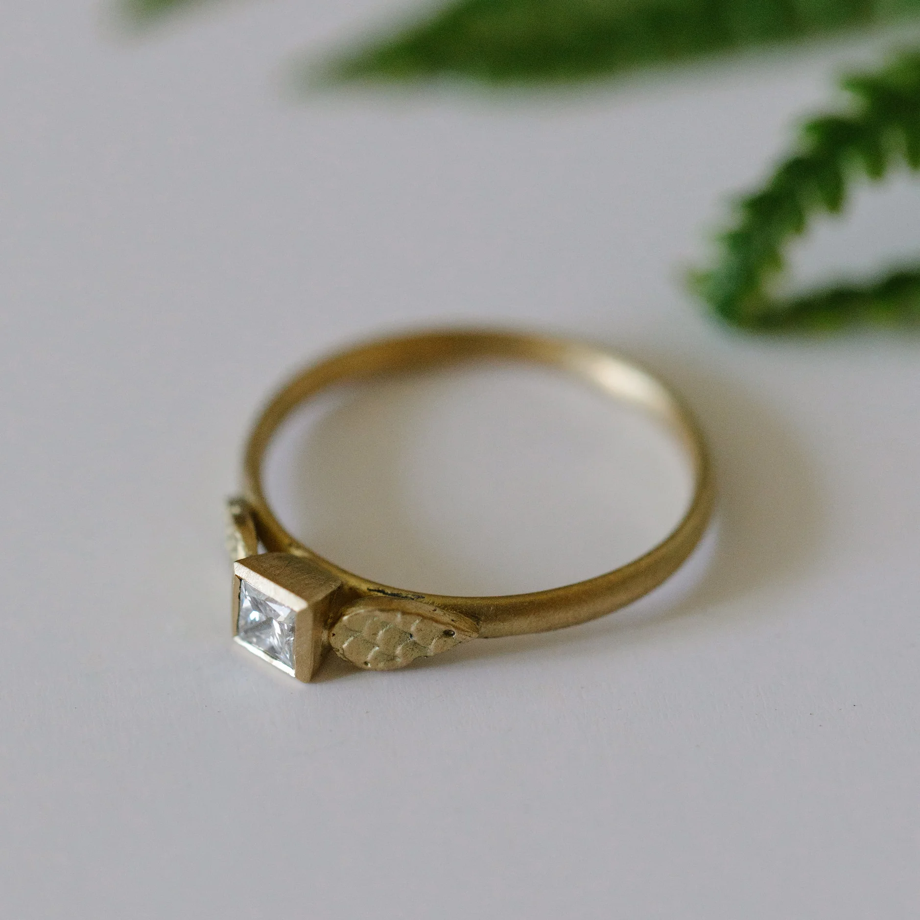 44 Square diamond solitaire with catkin drop shoulders styled.jpg
