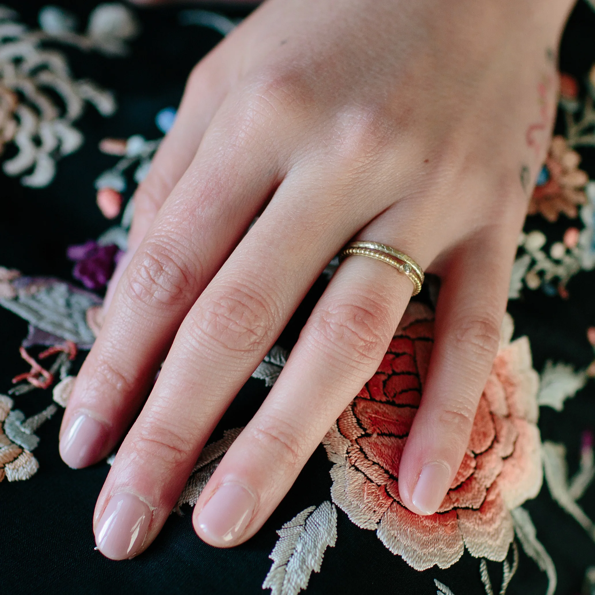 45 tiny catkin wedding ring on model.jpg