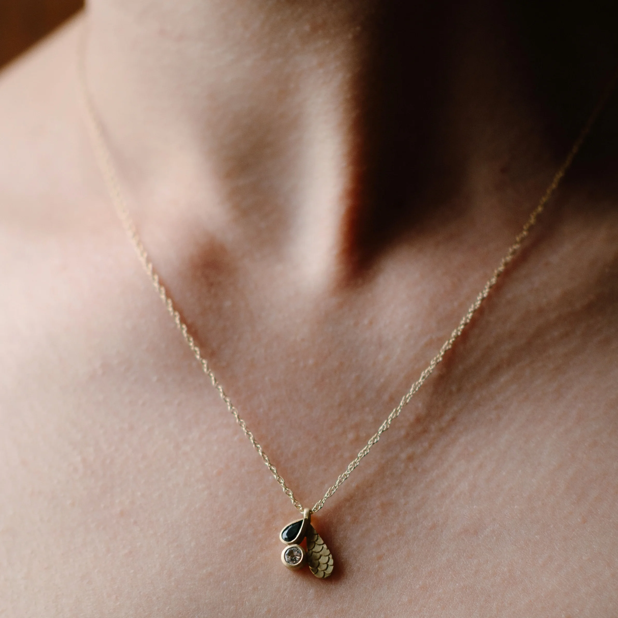 CATKIN DROPLET BLUE TOURMALINE PENDANT ON MODEL.jpg