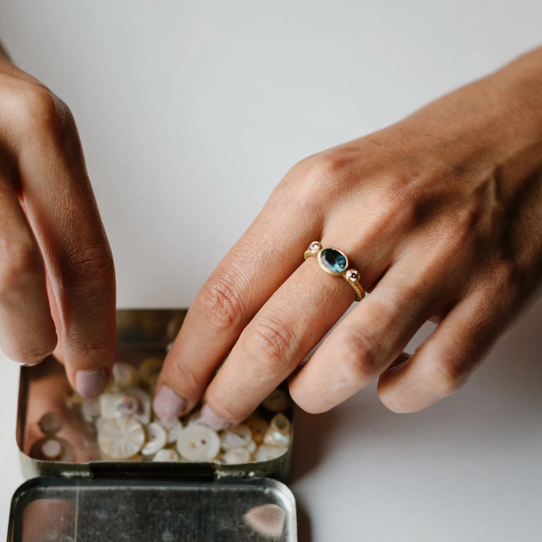 LARGE OVAL BLUE TOURMALINE COUPLED DOTTY RING on modle copy.jpg