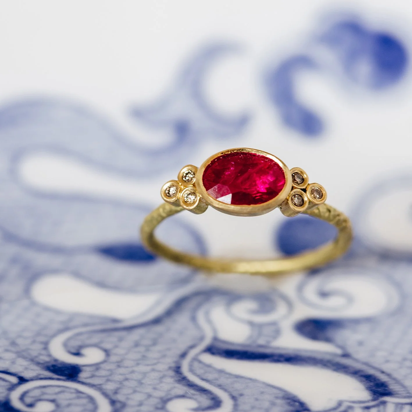 Catkin Oval Ruby Ring with Tri Diamond Shoulders