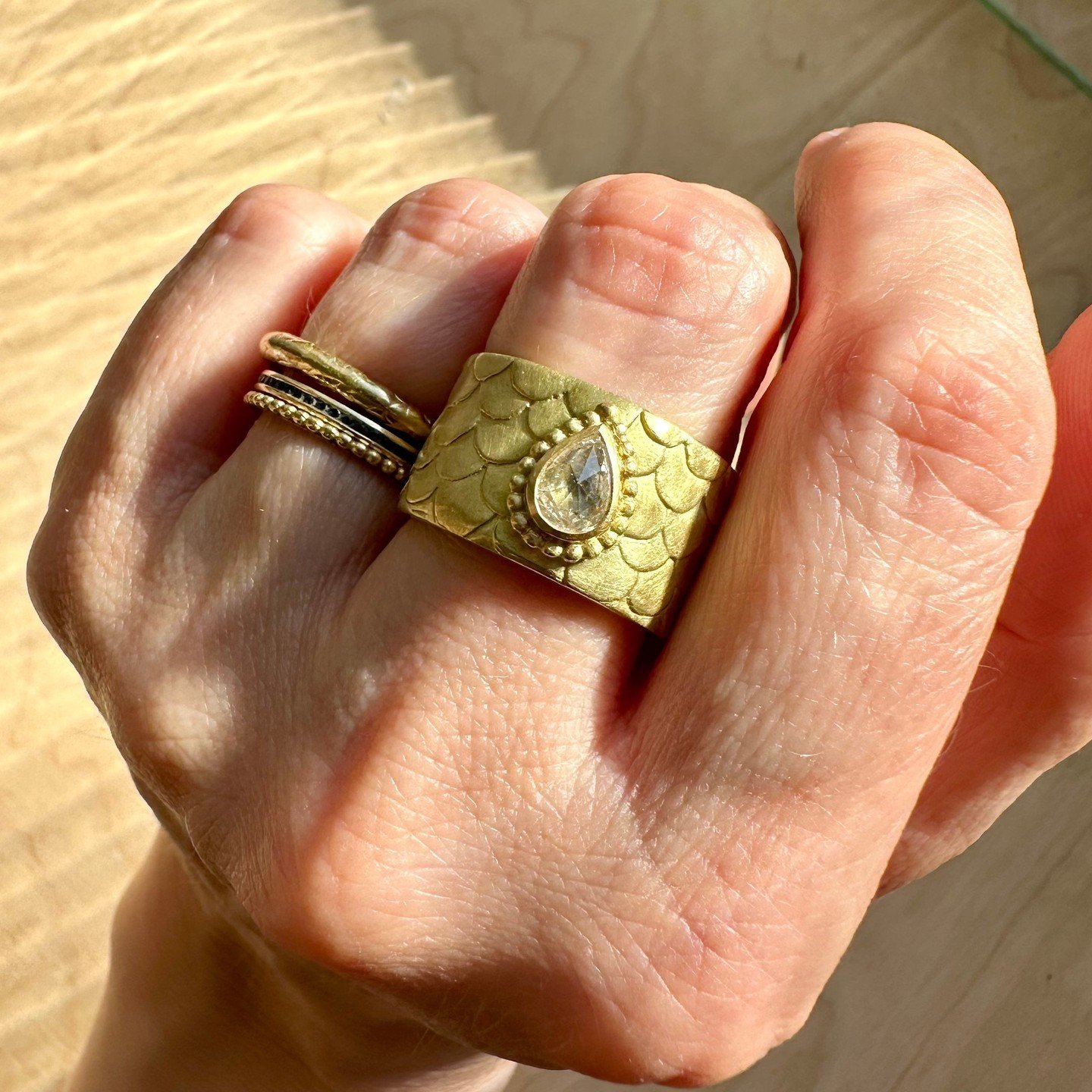 We love a celebration and creating the perfect memento for any occasion. This snug ring is a beautiful example of just that; alluring Fairtrade gold envelopes the wearer's finger to make the show-stopping Snug ring. This bold new design is topped wit