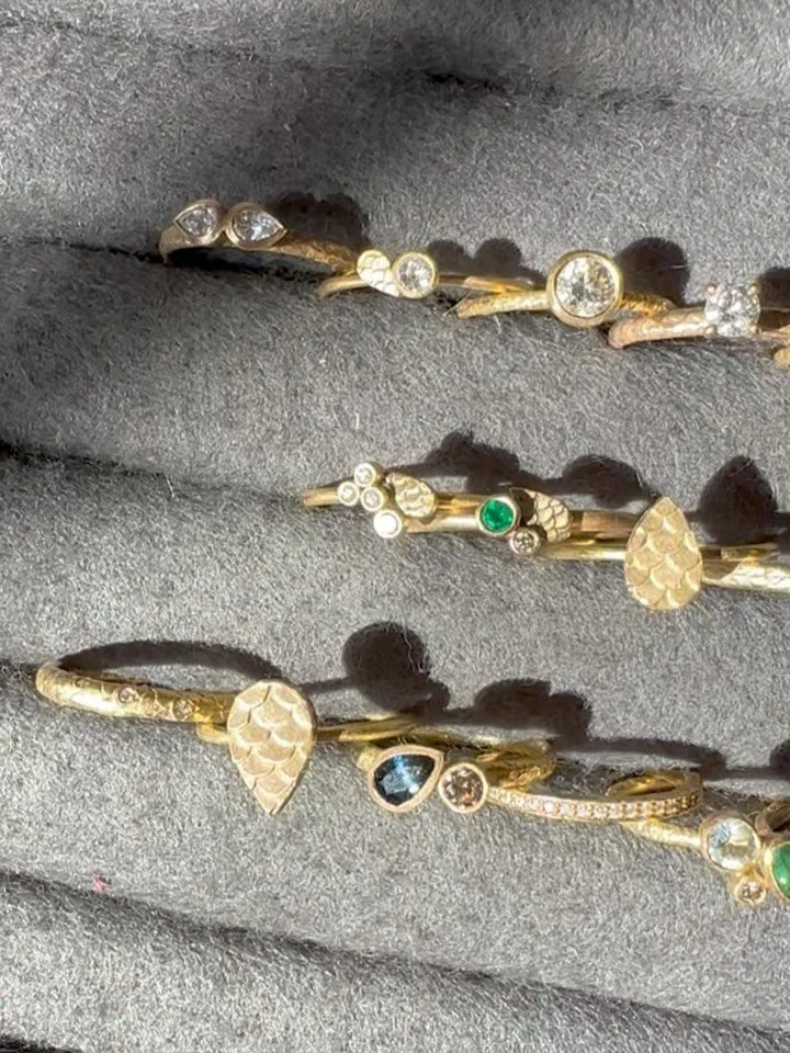 Afternoon light streaming through the atelier, catching on diamonds, sapphires, tourmalines and aquamarines &mdash; each ring sparking to life.
Whether you&rsquo;re looking for something classic or full of colour, your dream piece might already be he