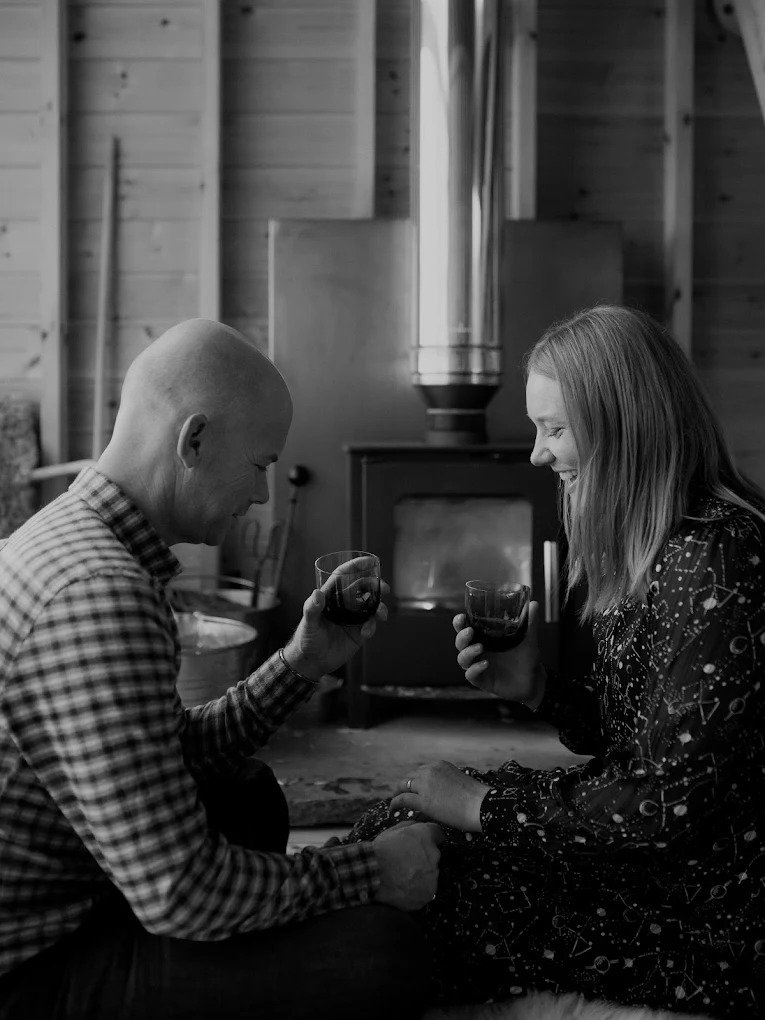 couple putting on their scottish made bespoke wedding rings