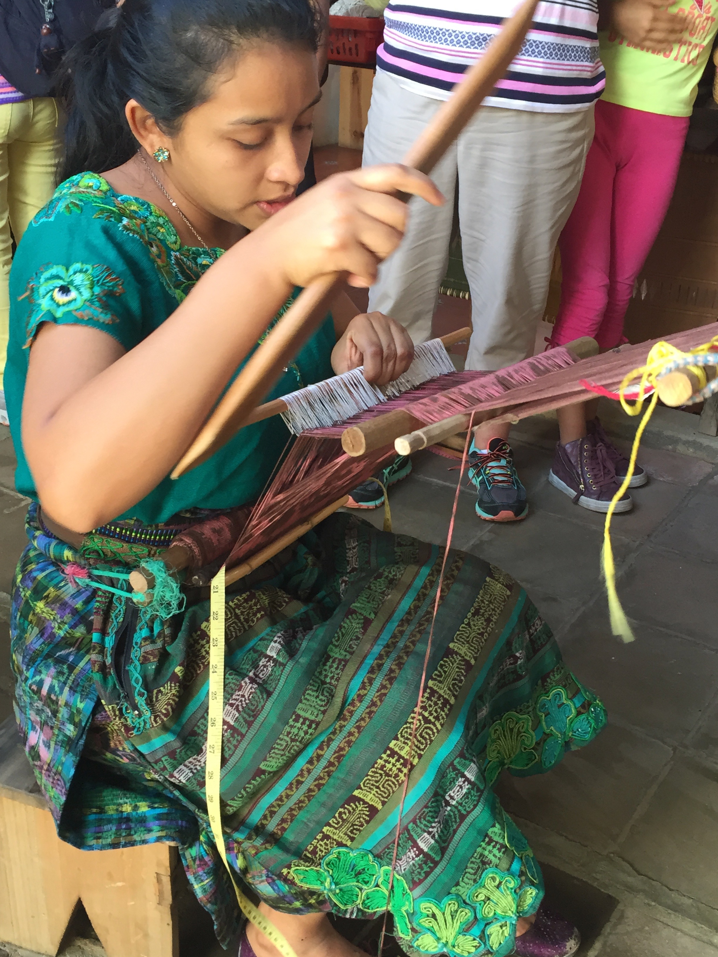 weaving demo at woman coop.jpg