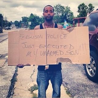 Mr. Louis Head: Ferguson Police Just Executed My Unarmed Son, Sign, 2014, used with permission of Mr. Head.