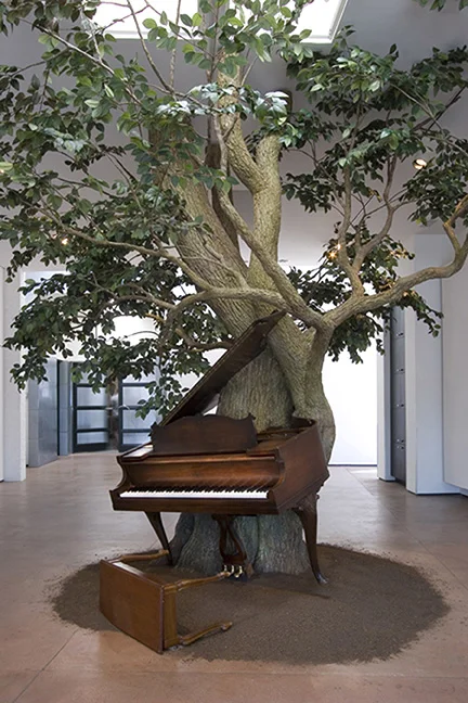 Blossom, 2007 Steel, Zoopoxy, silk leaves, piano with MIDI system, piano bench, dirt 144 x 216 x 180 inches 365.8 x 548.6 x 457.2 cm Courtesy of the artist and Marianne Boesky Gallery, New York and Aspen. ©Sanford Biggers.