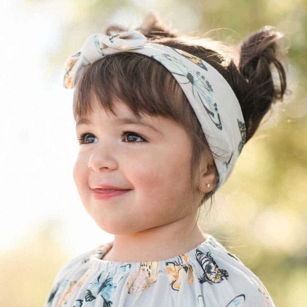 Baby-Girl-Wearing-the-Butterfly-Bamboo-Knotted-Headband-by-Milkbarn-Kids_f3e3f842-8979-4fbf-b8f2-80b087b55e56.jpg