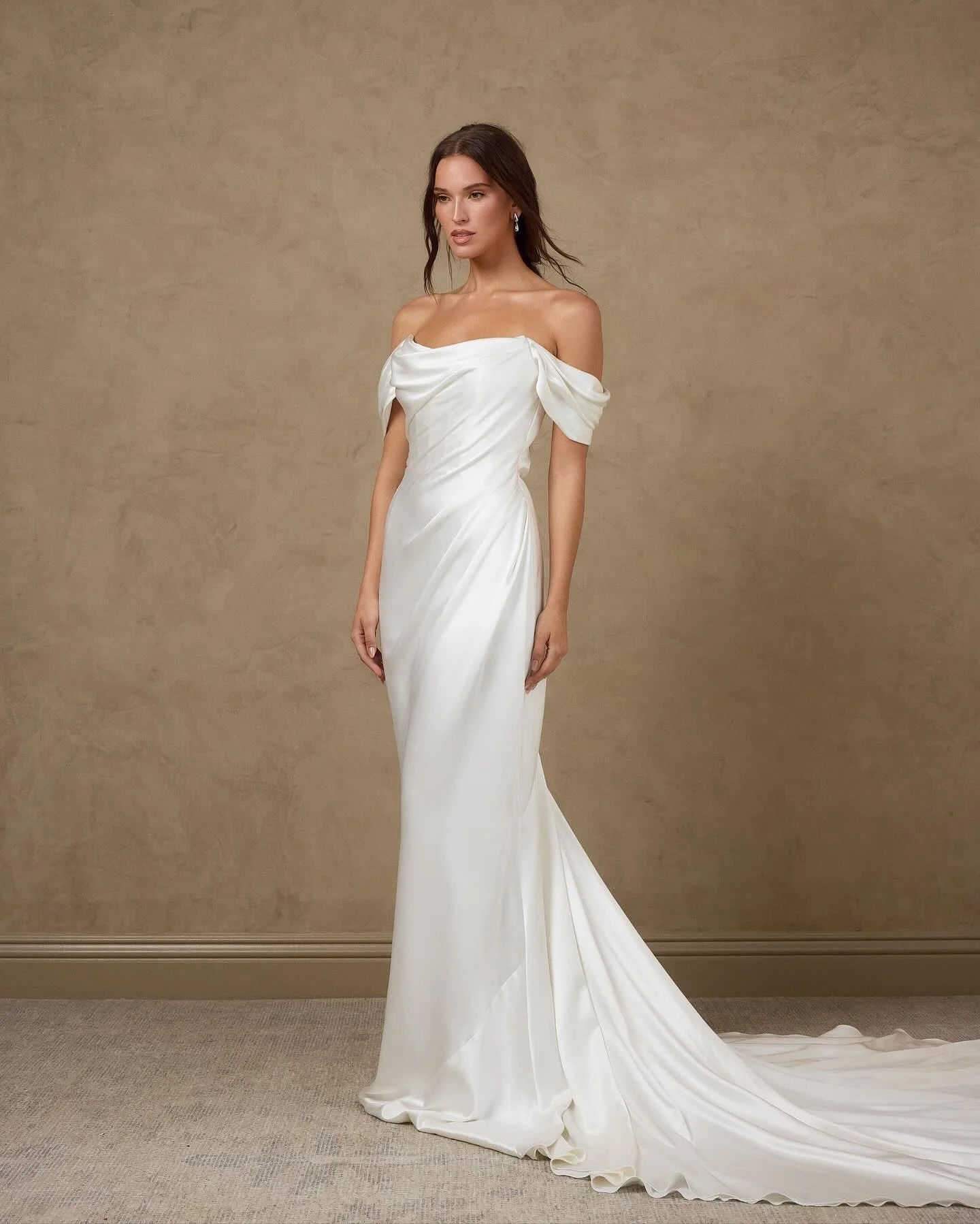 Meet the Eva wedding gown by @katherinetash. 
A dress that effortlessly flows around the body in the softest silk satin crepe. Sleeves can be worn up or off shoulder, offering multiple styling options for our bride.
Eva can be worn together with the 