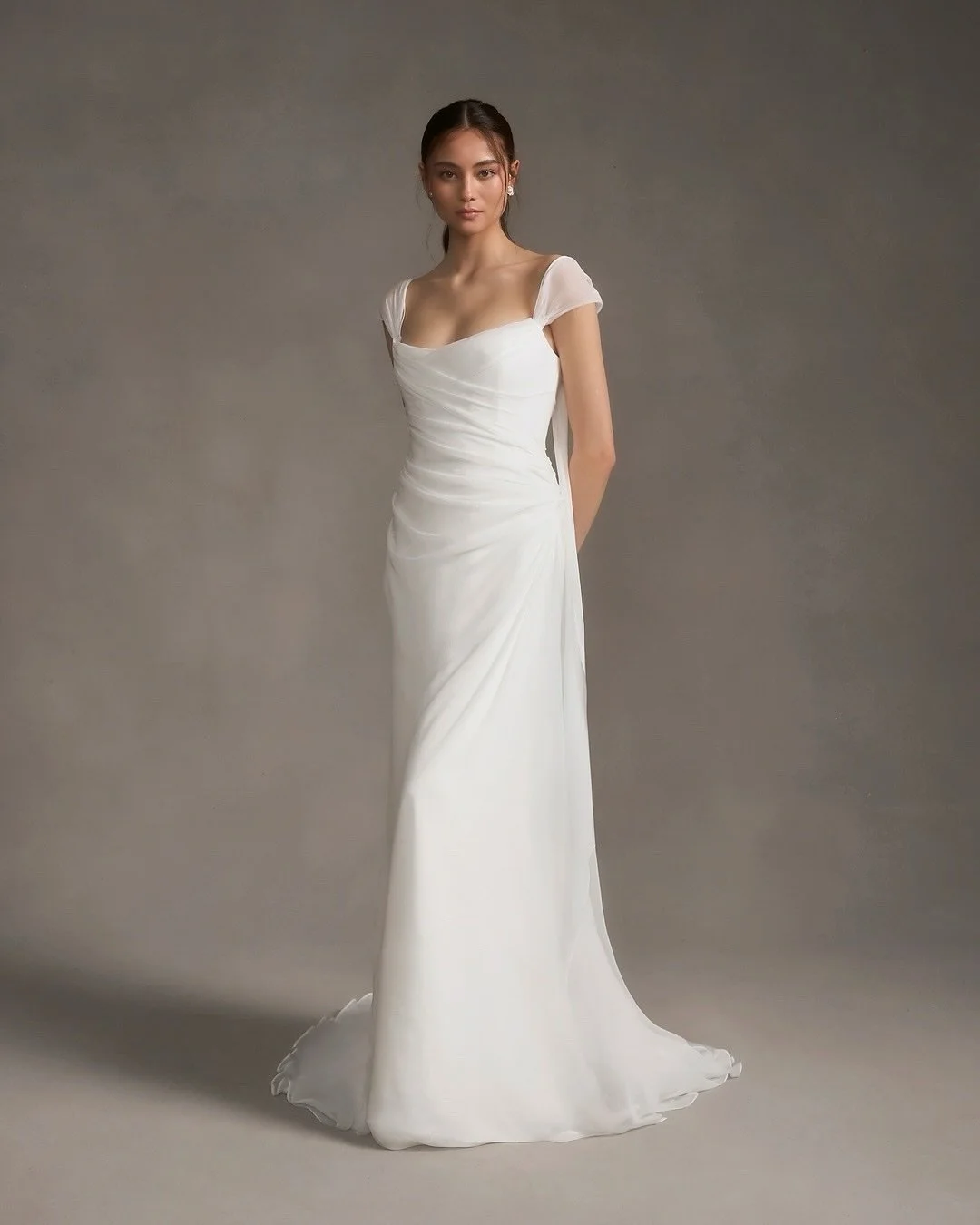 Isadora by @alexandragrecco
A stunning gown with internal structure hidden beneath layers of ethereal silk chiffon draping. Elongated straps offer our brides the option to style in multiple ways - cap sleeves, off-the-shoulder, strapless or halter. H