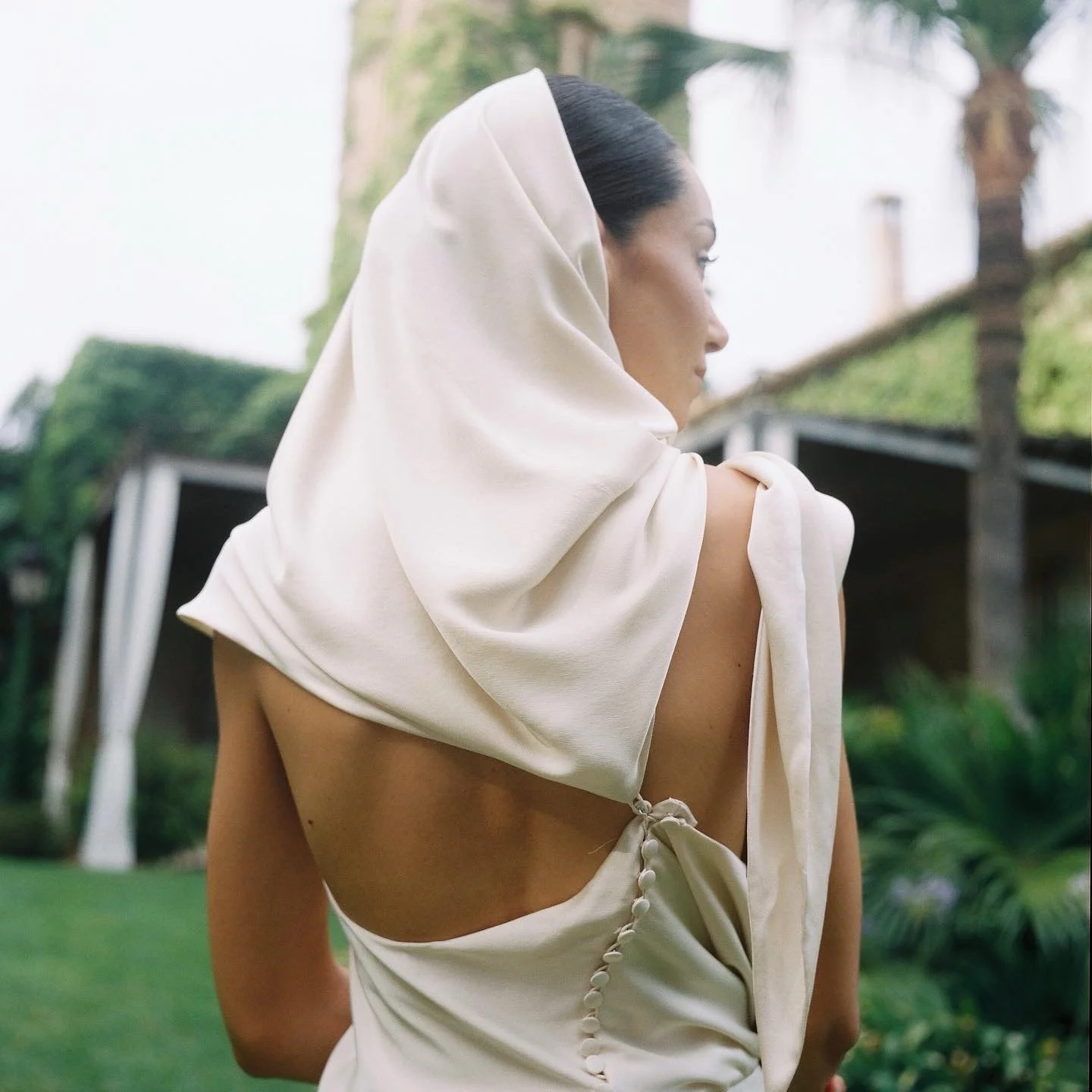 REAL BRIDE | Casandra wore the Helene bridal gown by @cortanabrides and styled it in the most intricate way. 
Helene is a neckholder wedding dress with a shawl detail. It can be worn as a delicate hood - a beautiful alternative to a veil. 

Helene is