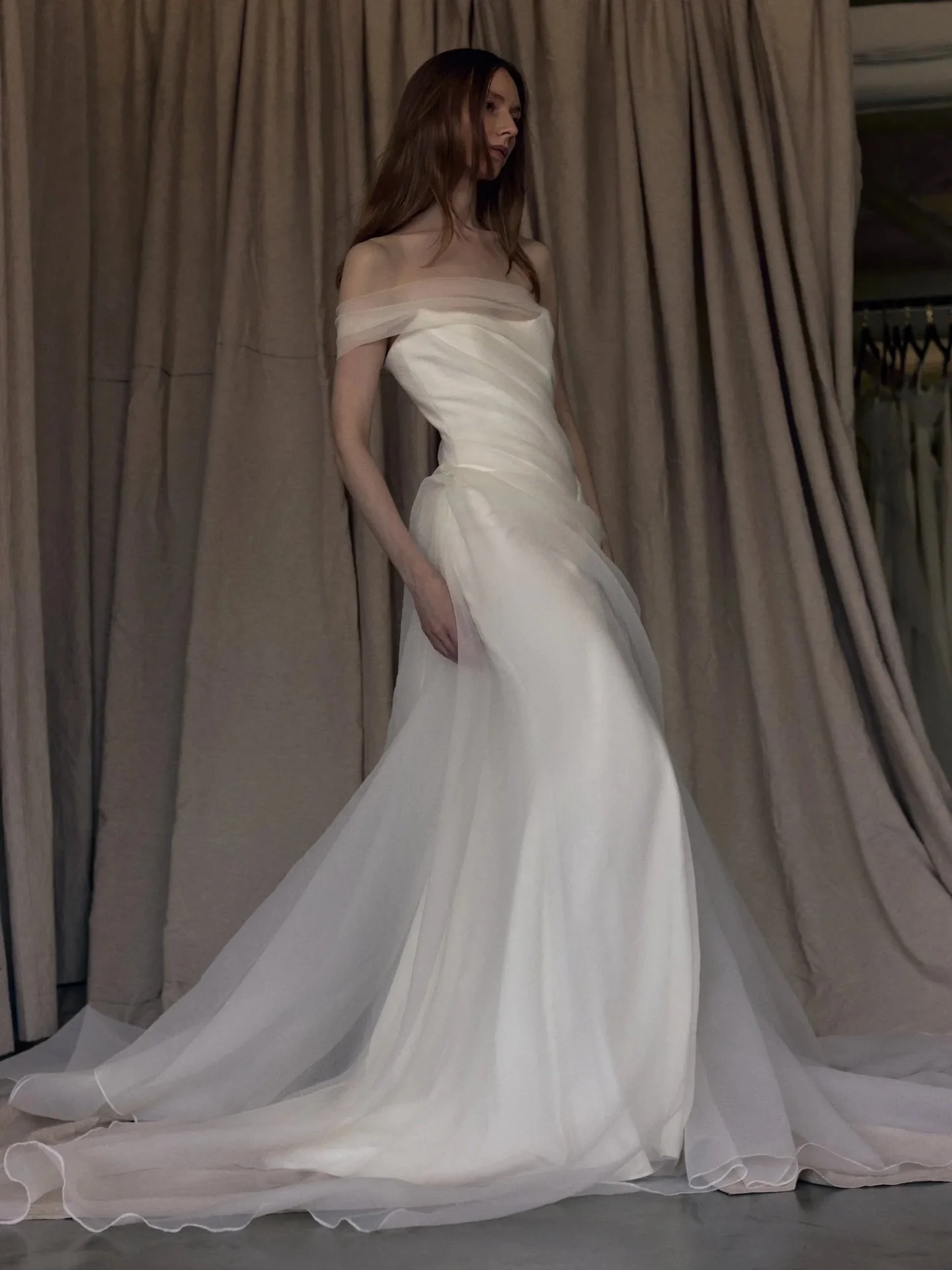 Please welcome the Elou wedding dress by @newhite_bridal. 
Elou is an A-line wedding gown with a double silhouette, created by a layer of NEWHITE&rsquo;s signature textured organza. 
One off-the-shoulder strap adds even more movement to the shape of 