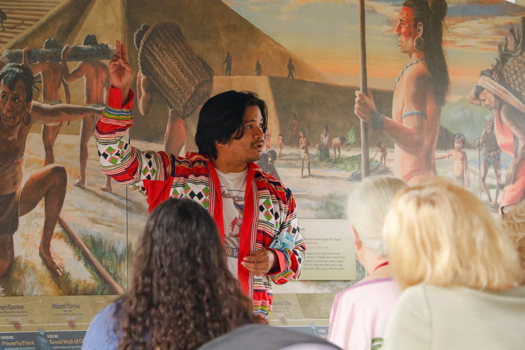 Members of the Miccosukee Tribe speaking to an audience.