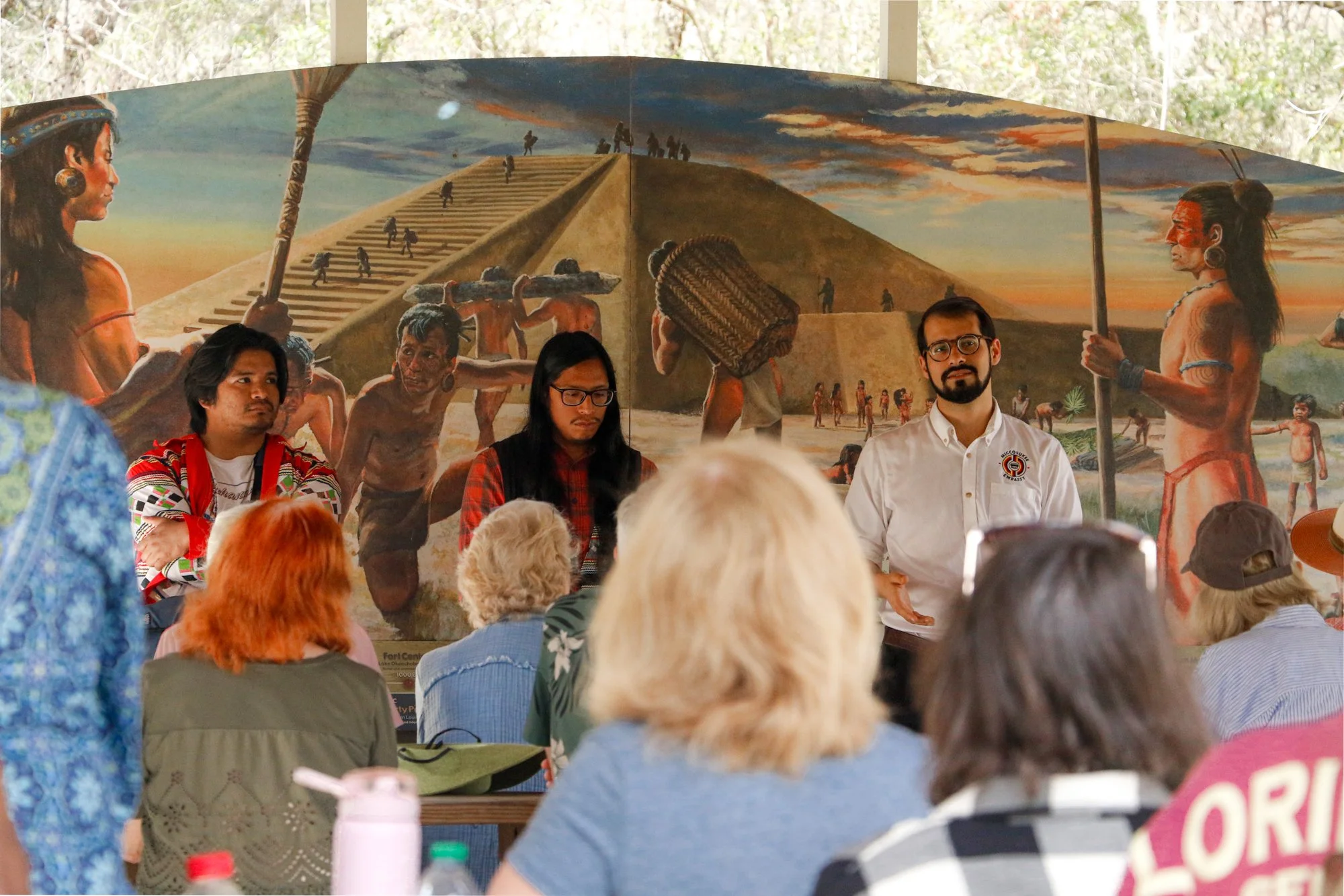 Members of the Miccosukee Tribe speaking to an audience.