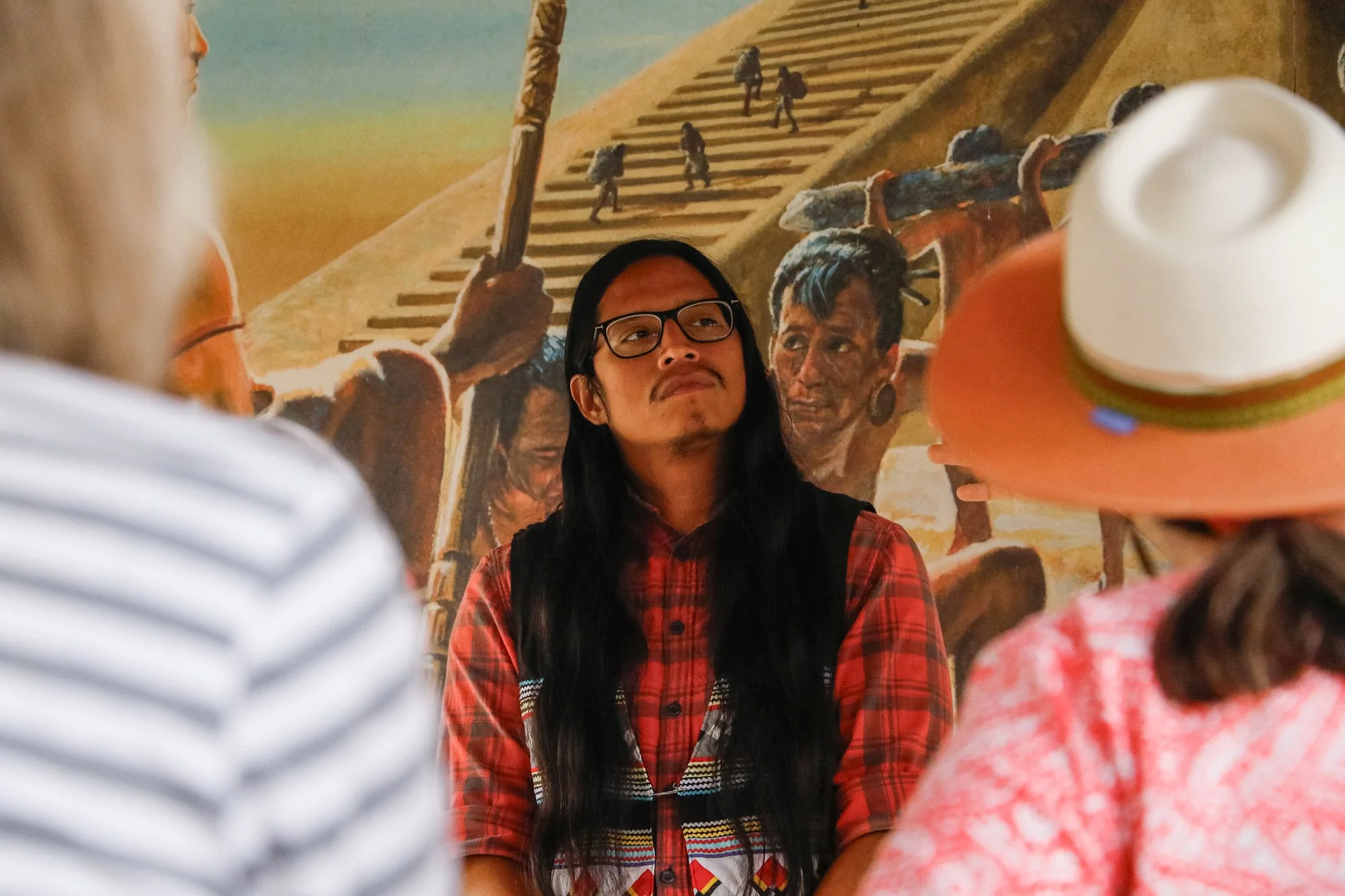 Members of the Miccosukee Tribe speaking to an audience.