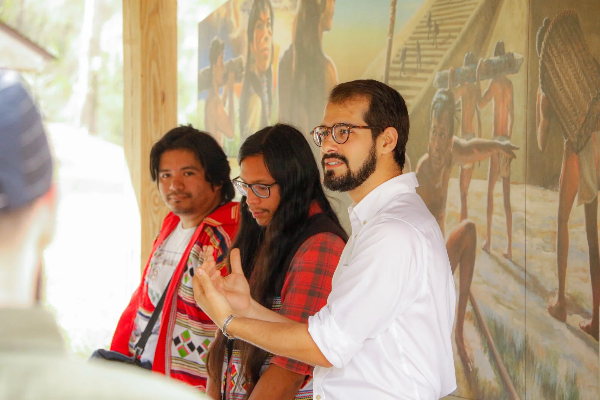 Members of the Miccosukee Tribe speaking to an audience.