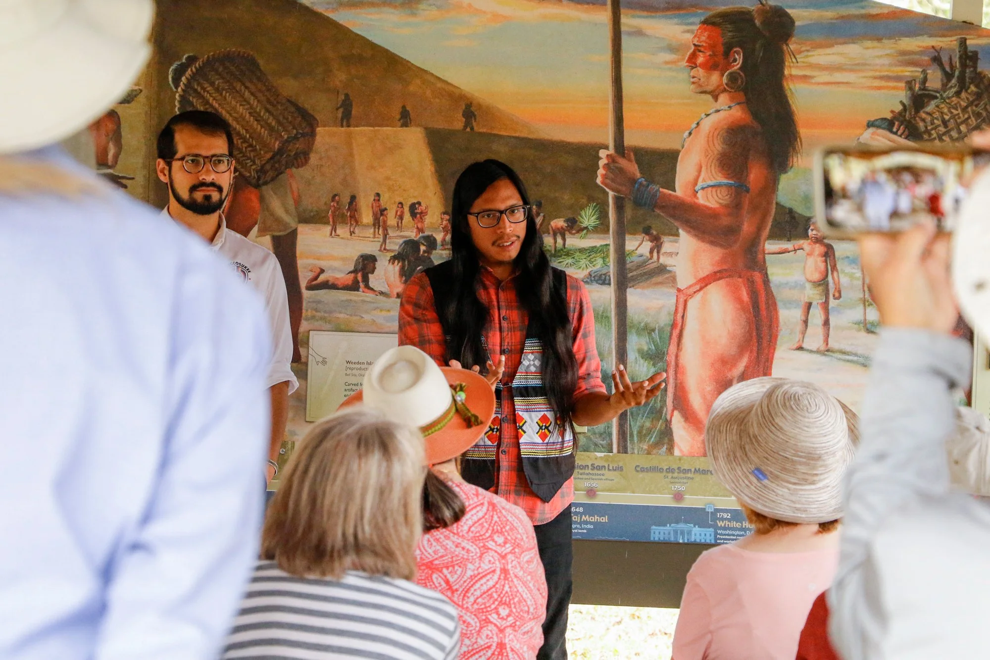 Members of the Miccosukee Tribe speaking to an audience.