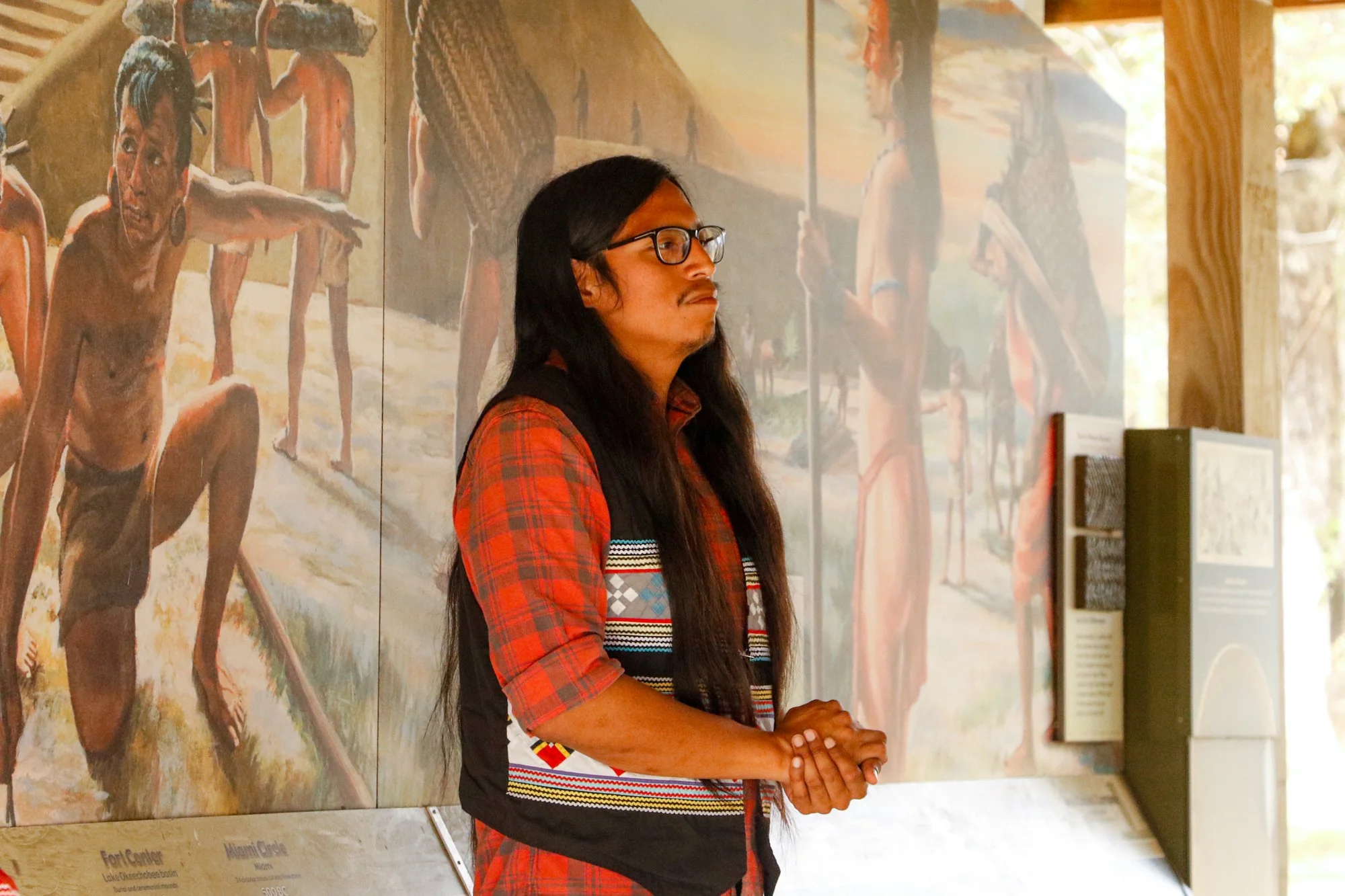 Members of the Miccosukee Tribe speaking to an audience.