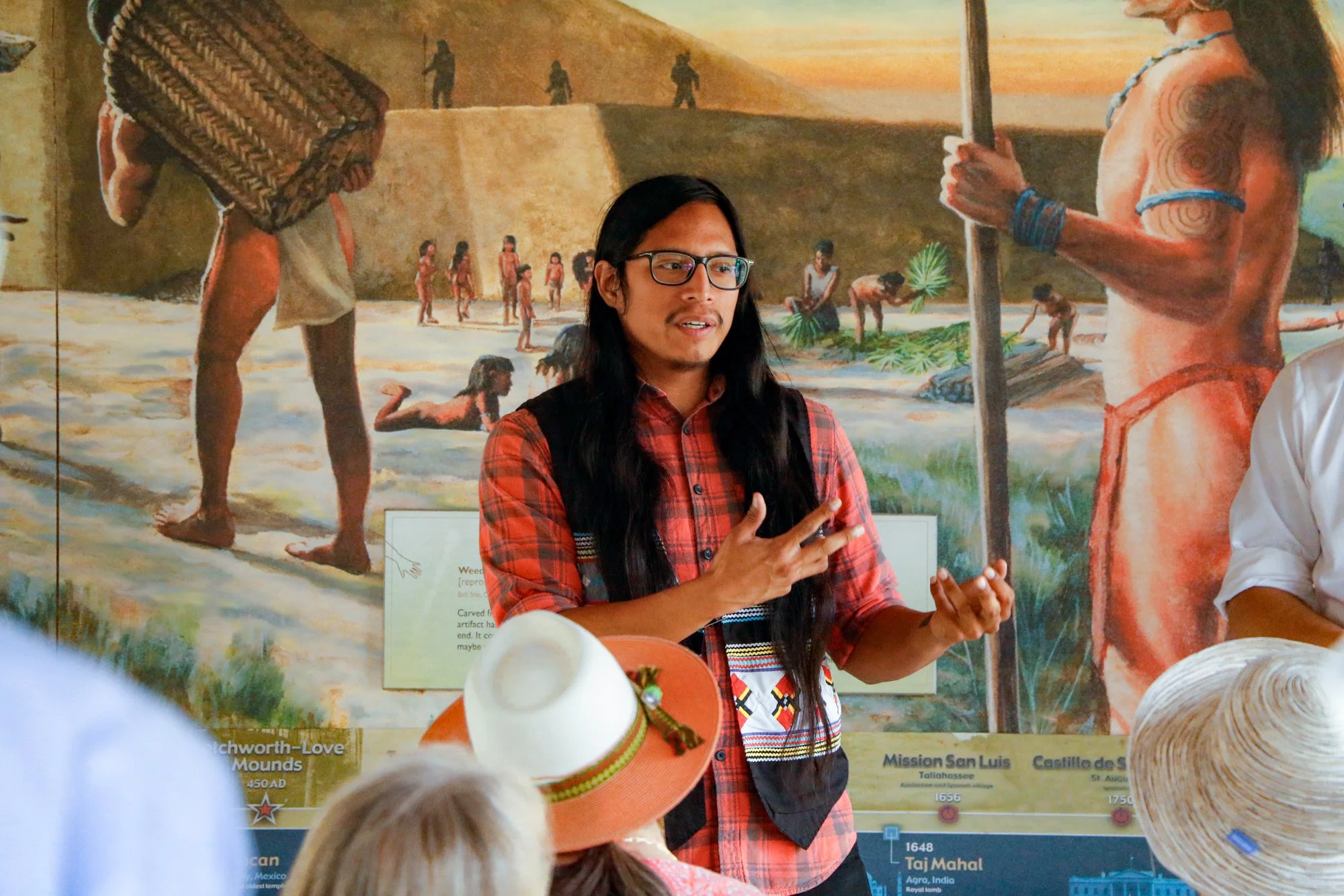 Members of the Miccosukee Tribe speaking to an audience.