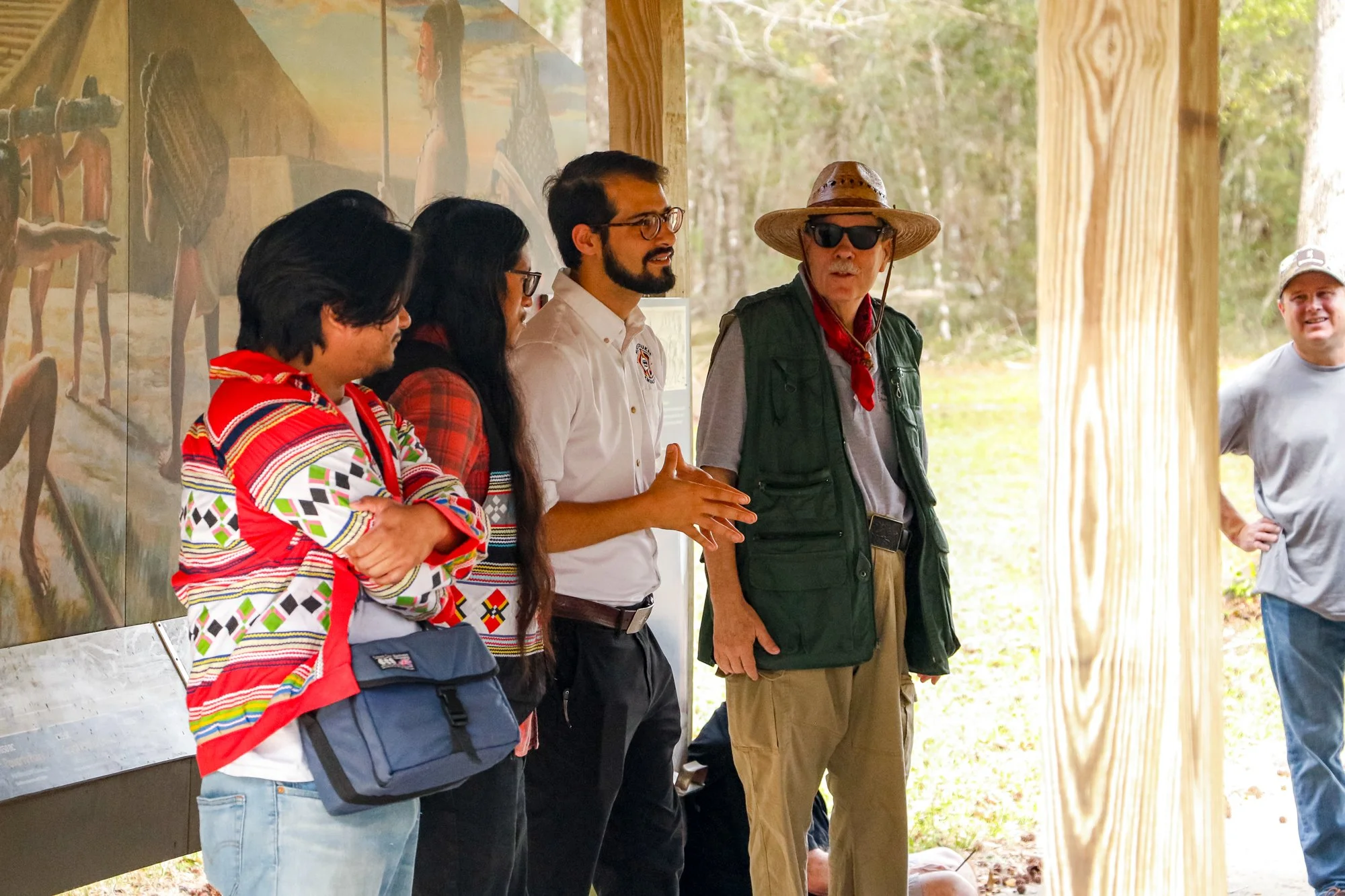 Members of the Miccosukee Tribe speaking to an audience.