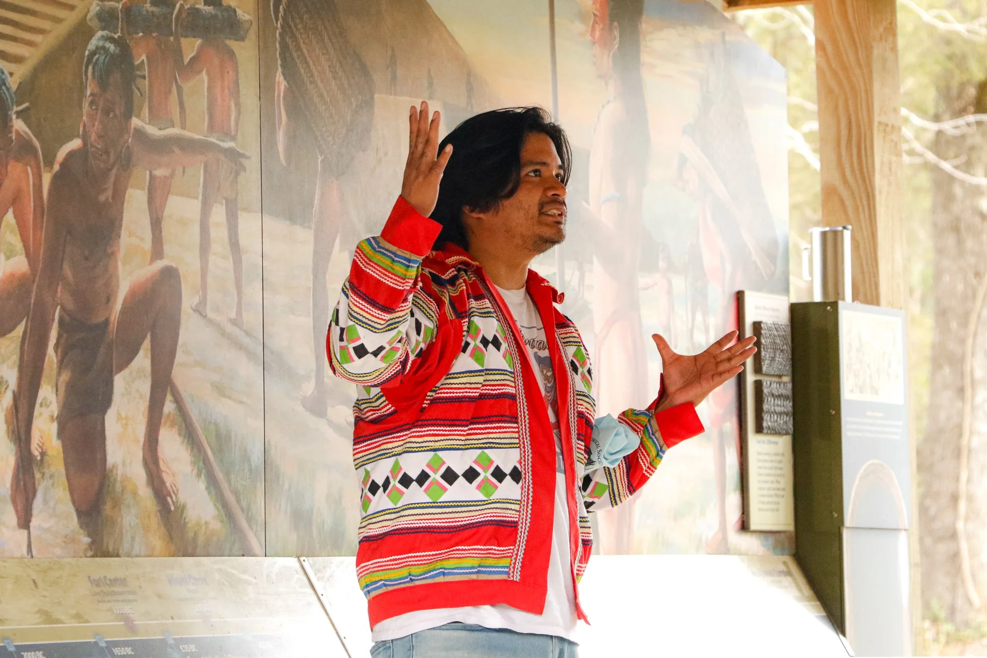 Members of the Miccosukee Tribe speaking to an audience.