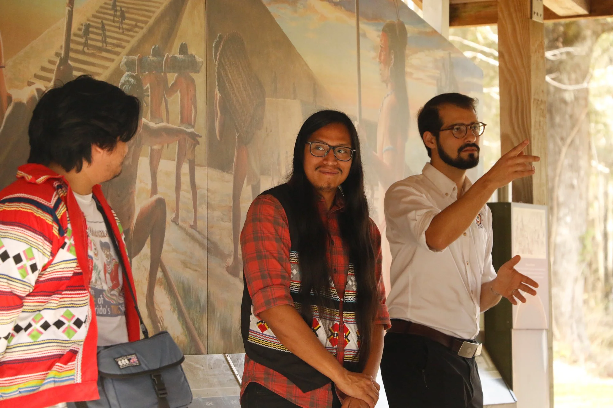 Members of the Miccosukee Tribe speaking to an audience.