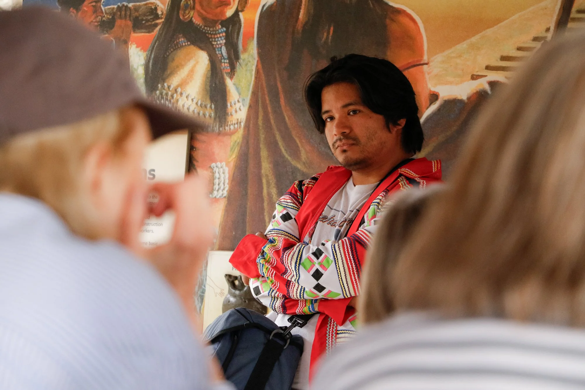 Members of the Miccosukee Tribe speaking to an audience.