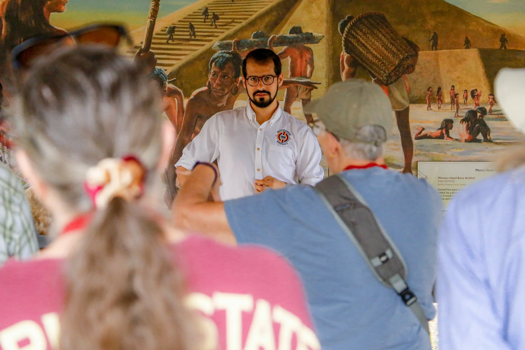 Members of the Miccosukee Tribe speaking to an audience.