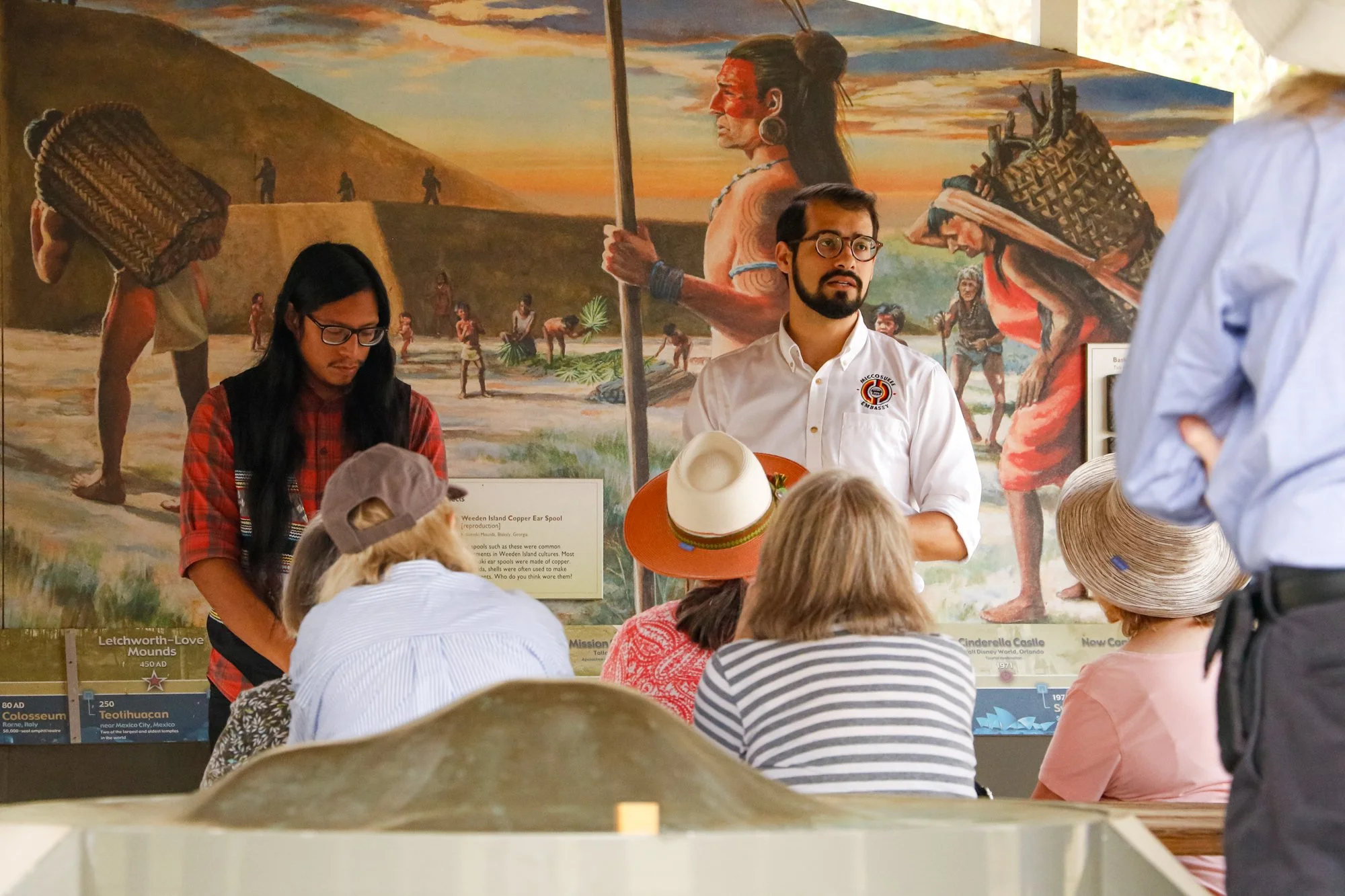 Members of the Miccosukee Tribe speaking to an audience.