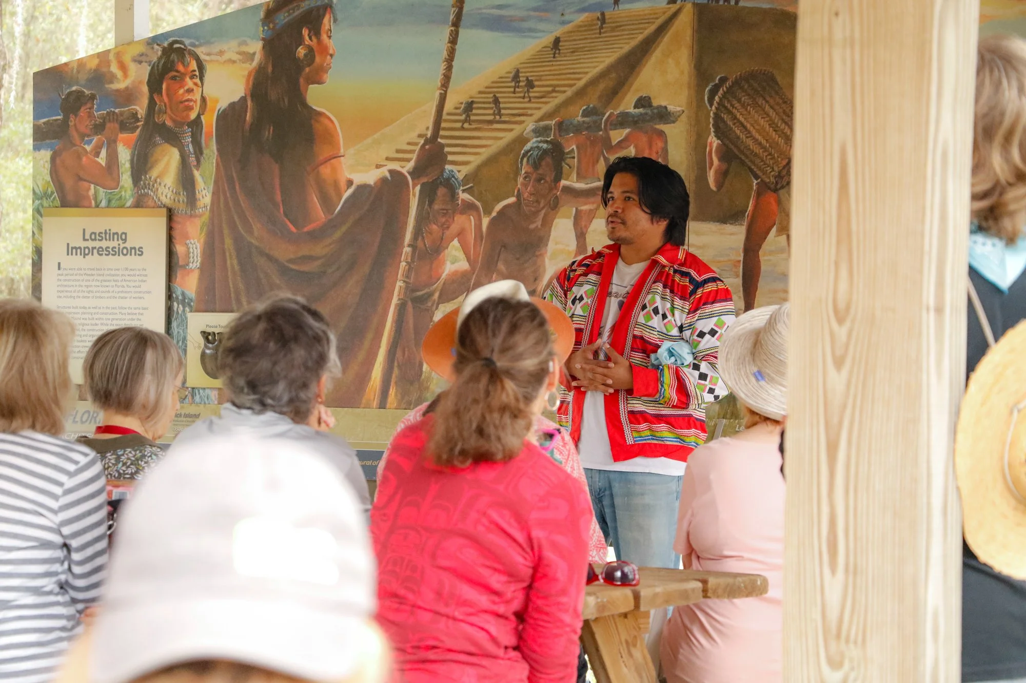 Members of the Miccosukee Tribe speaking to an audience.