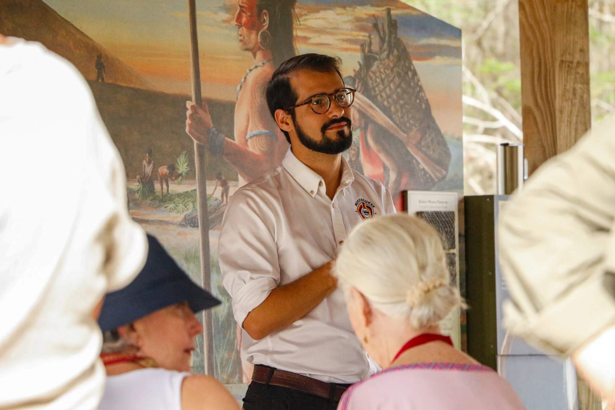 Members of the Miccosukee Tribe speaking to an audience.