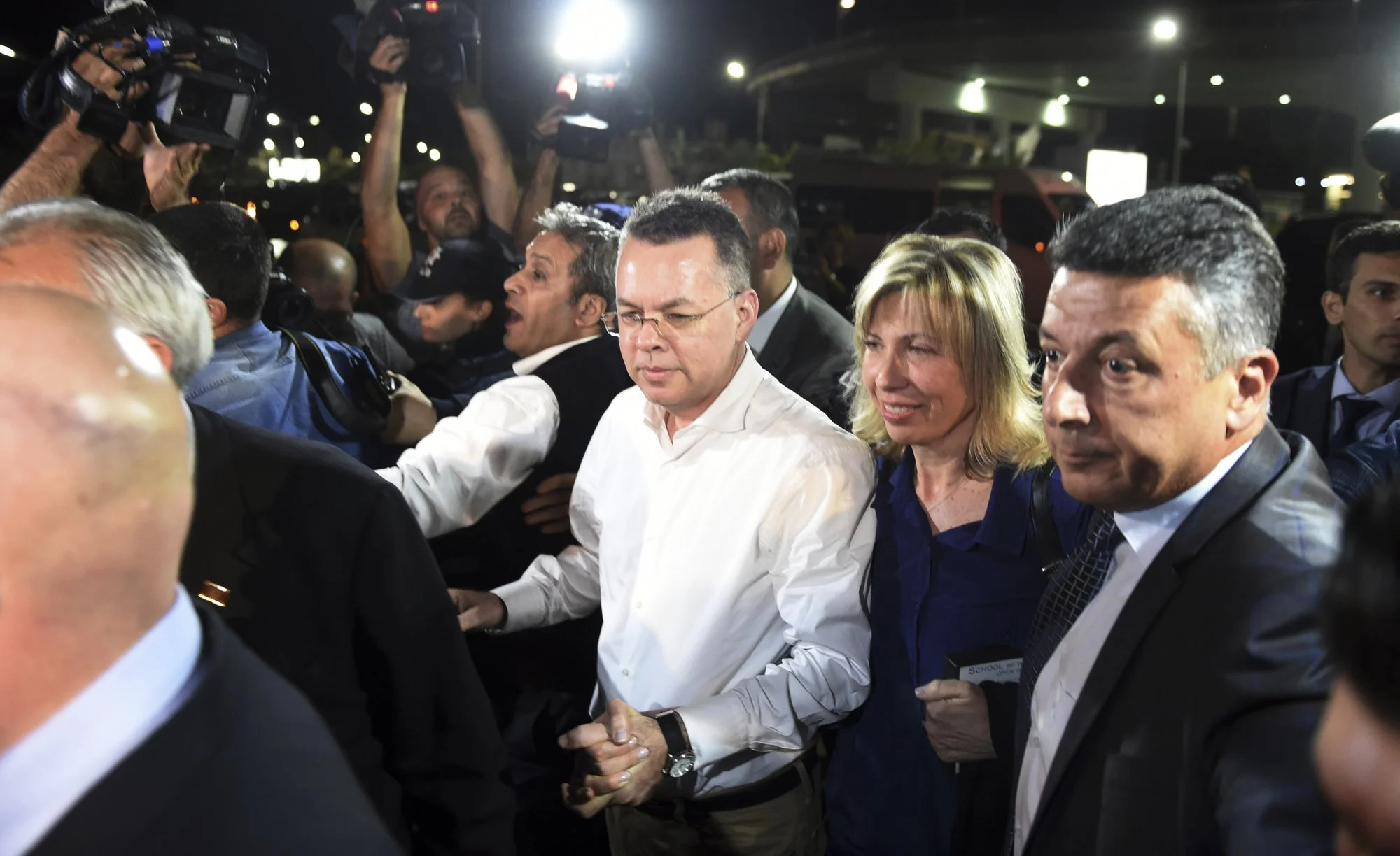 US pastor released from house arrest, flown out of Turkey