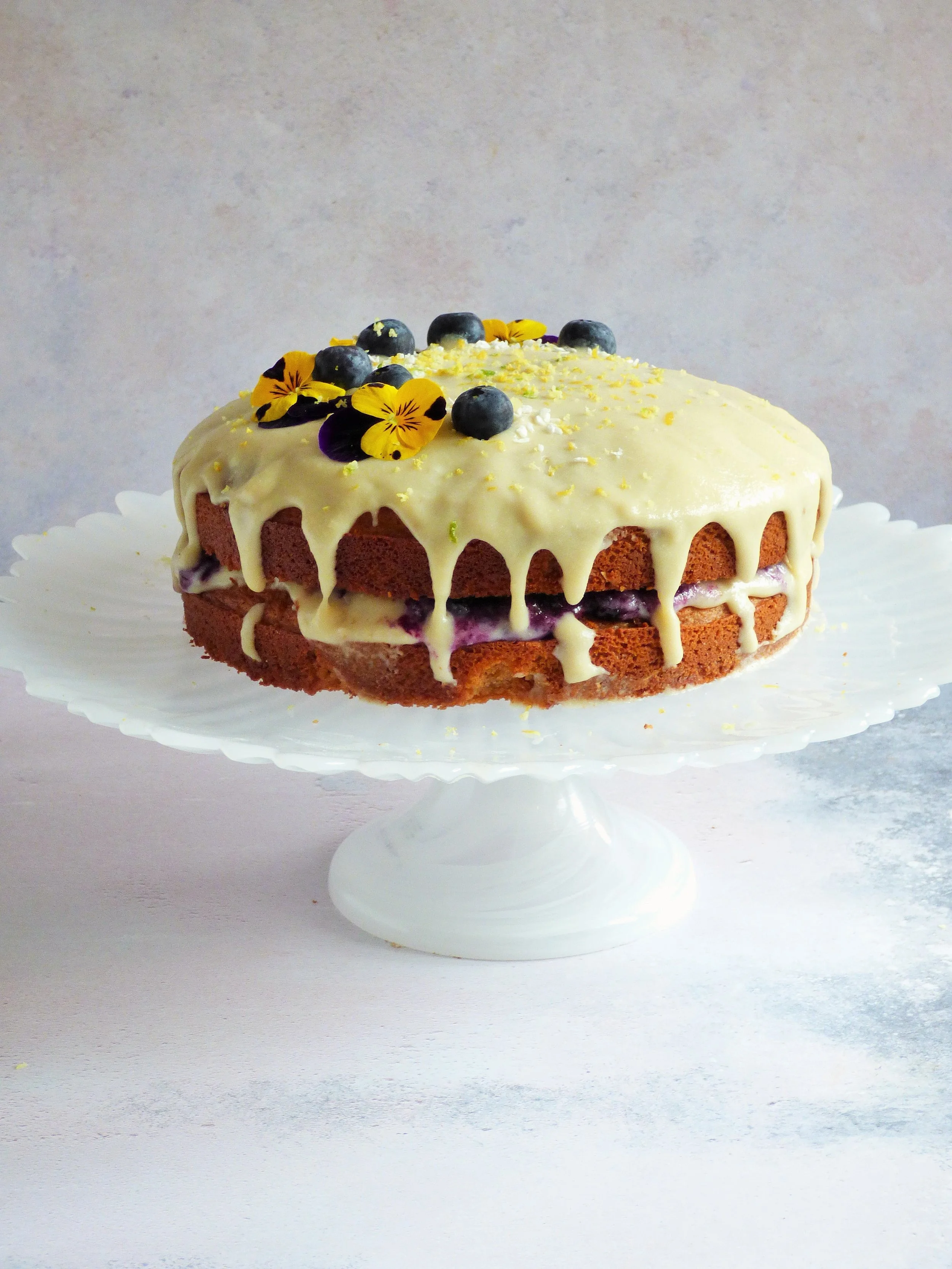 Lemon & blueberry cake with a white chocolate ganache drip