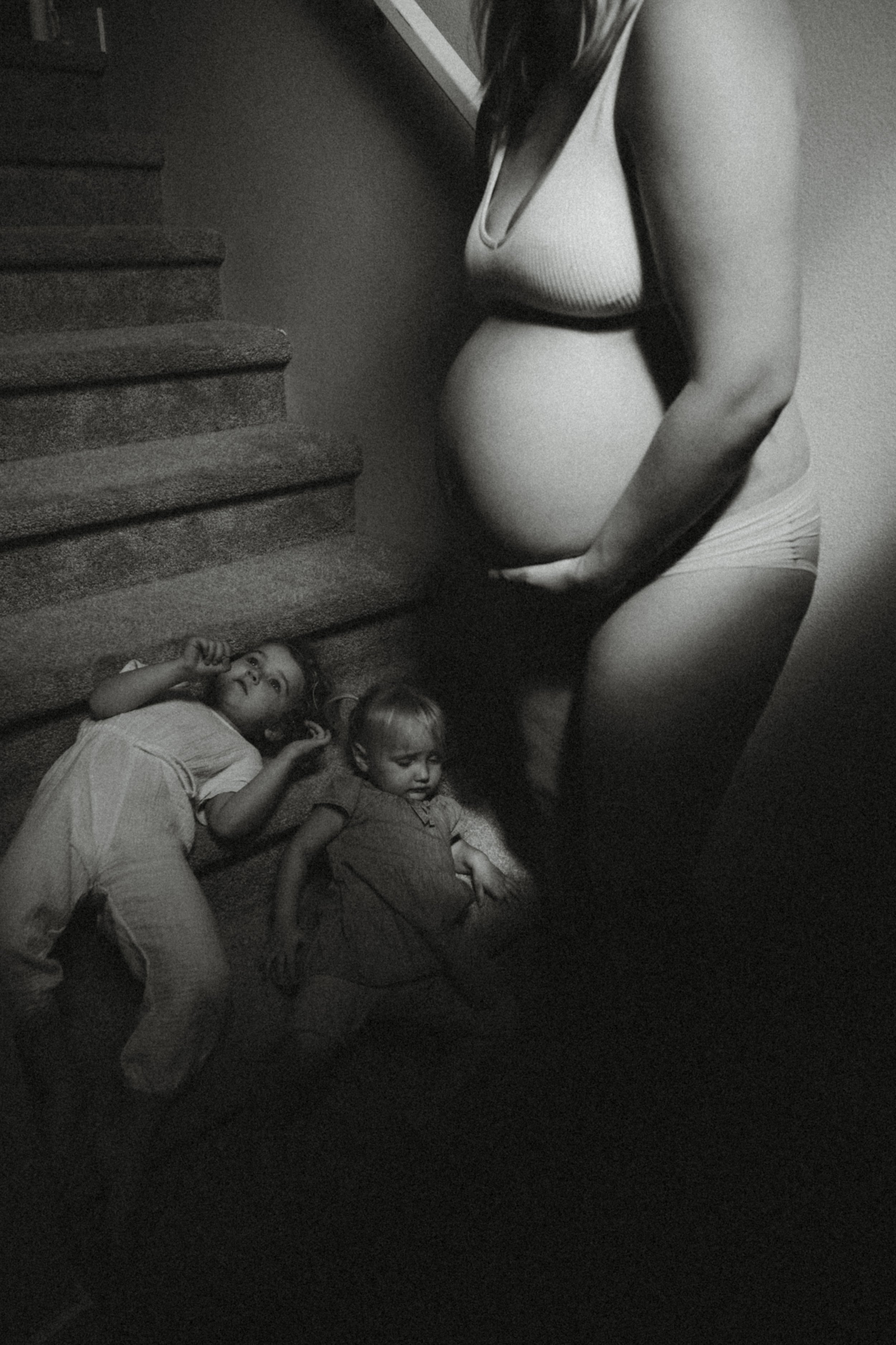 Documentary image of a mother and her children during Seattle moms pregnancy.