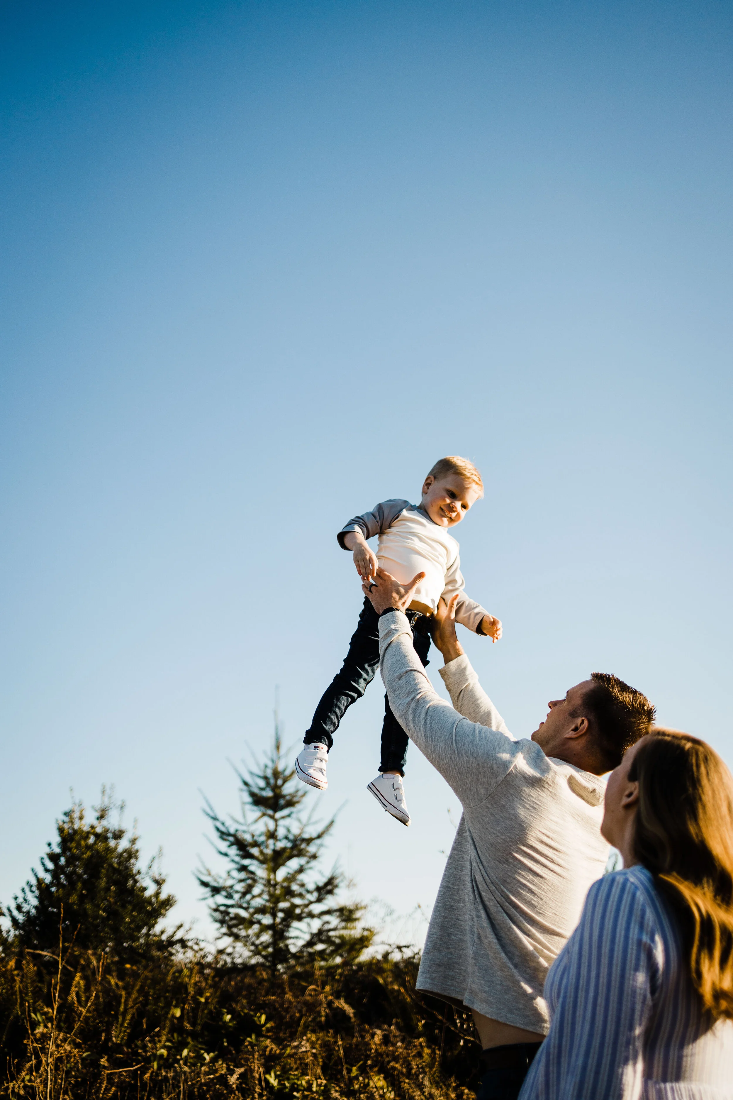 Dad tossing toddler in the air, Buckley, WA Family Photographer, Brooke Holliday photography