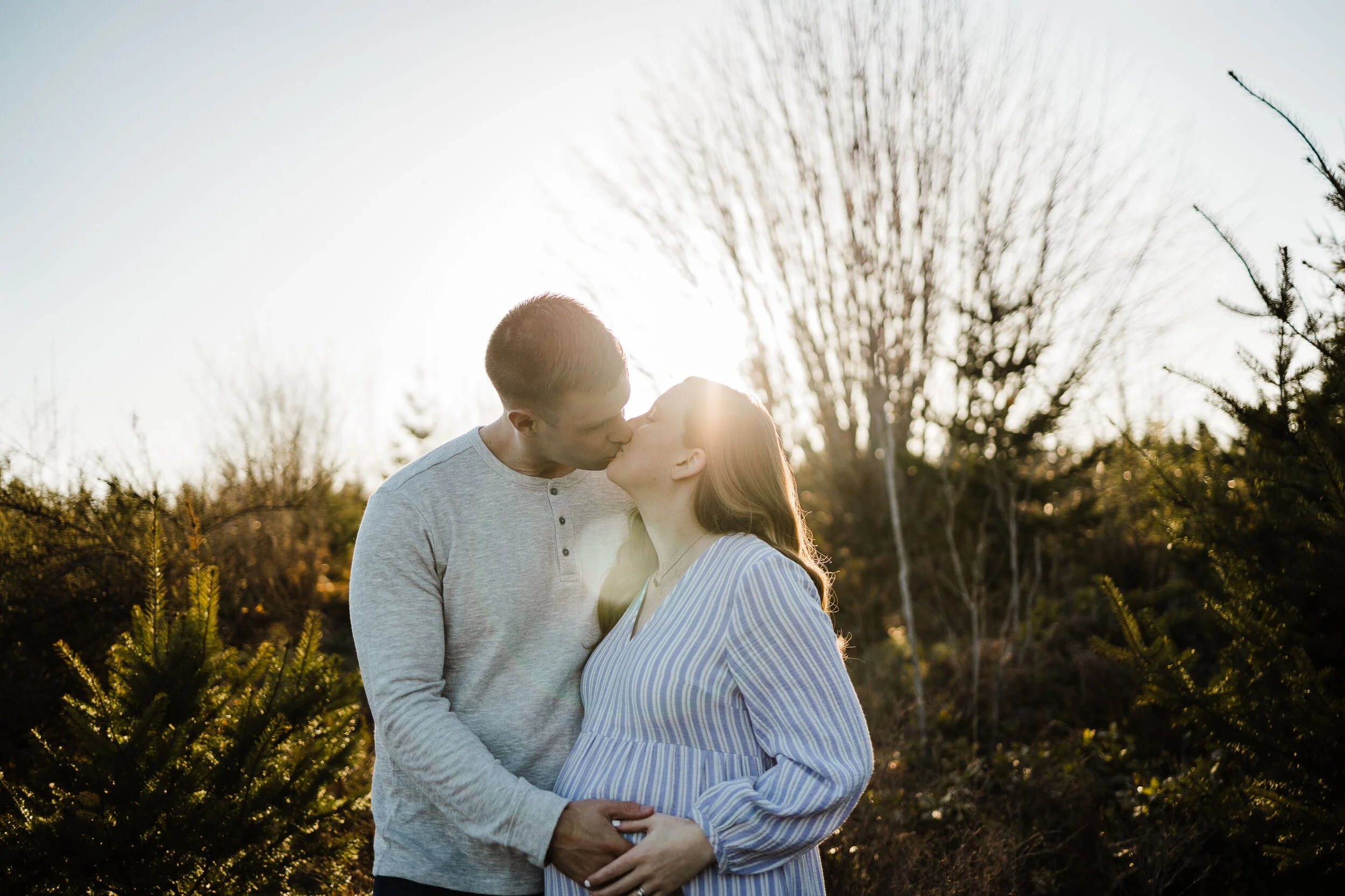 Expecting Couple share a kiss under Mount Rainer, Buckley, WA Family Photographer, Brooke Holliday Photography