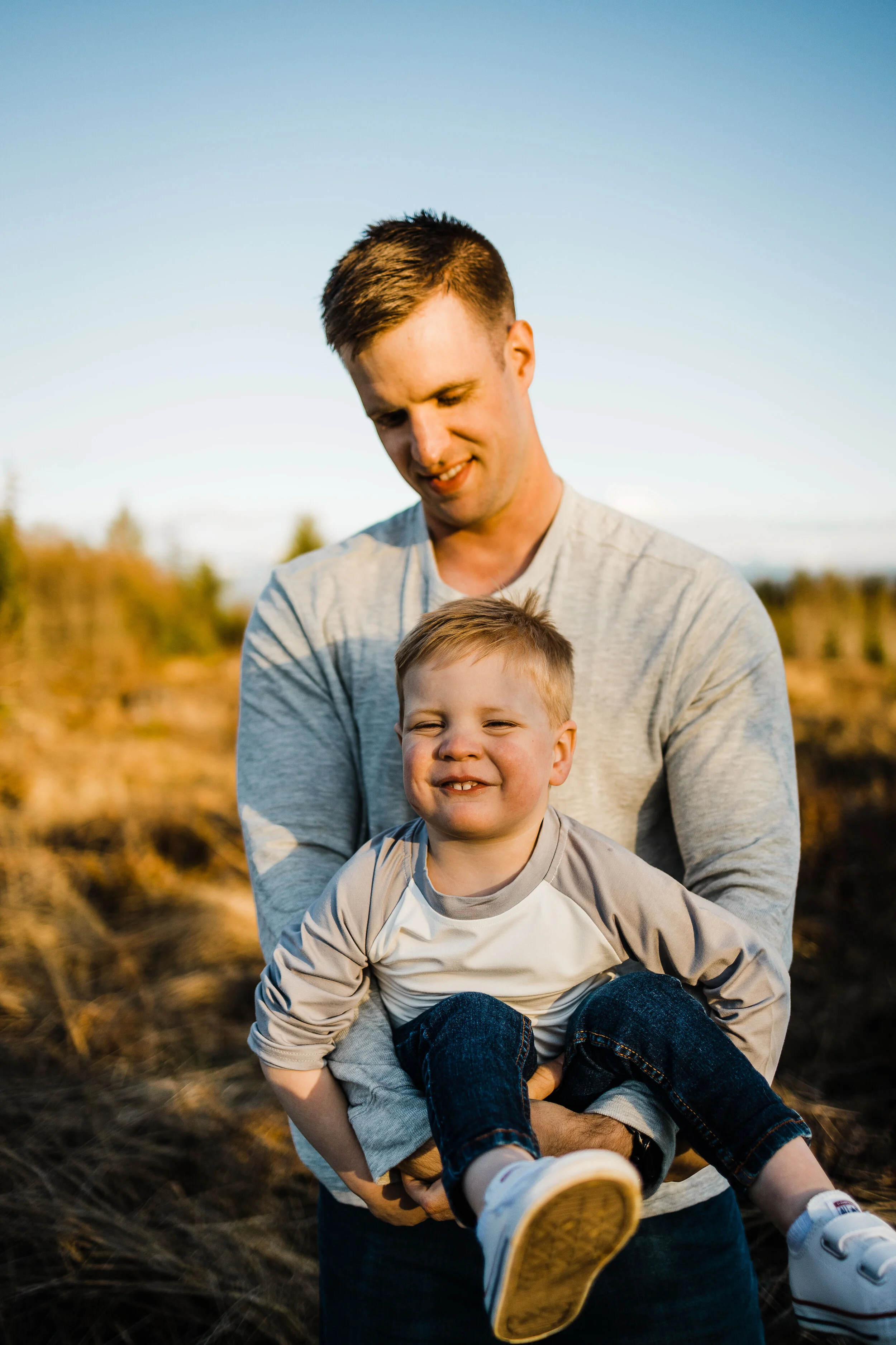 Dad cradles toddler, Buckley, WA family photographer, Brooke Holliday photography