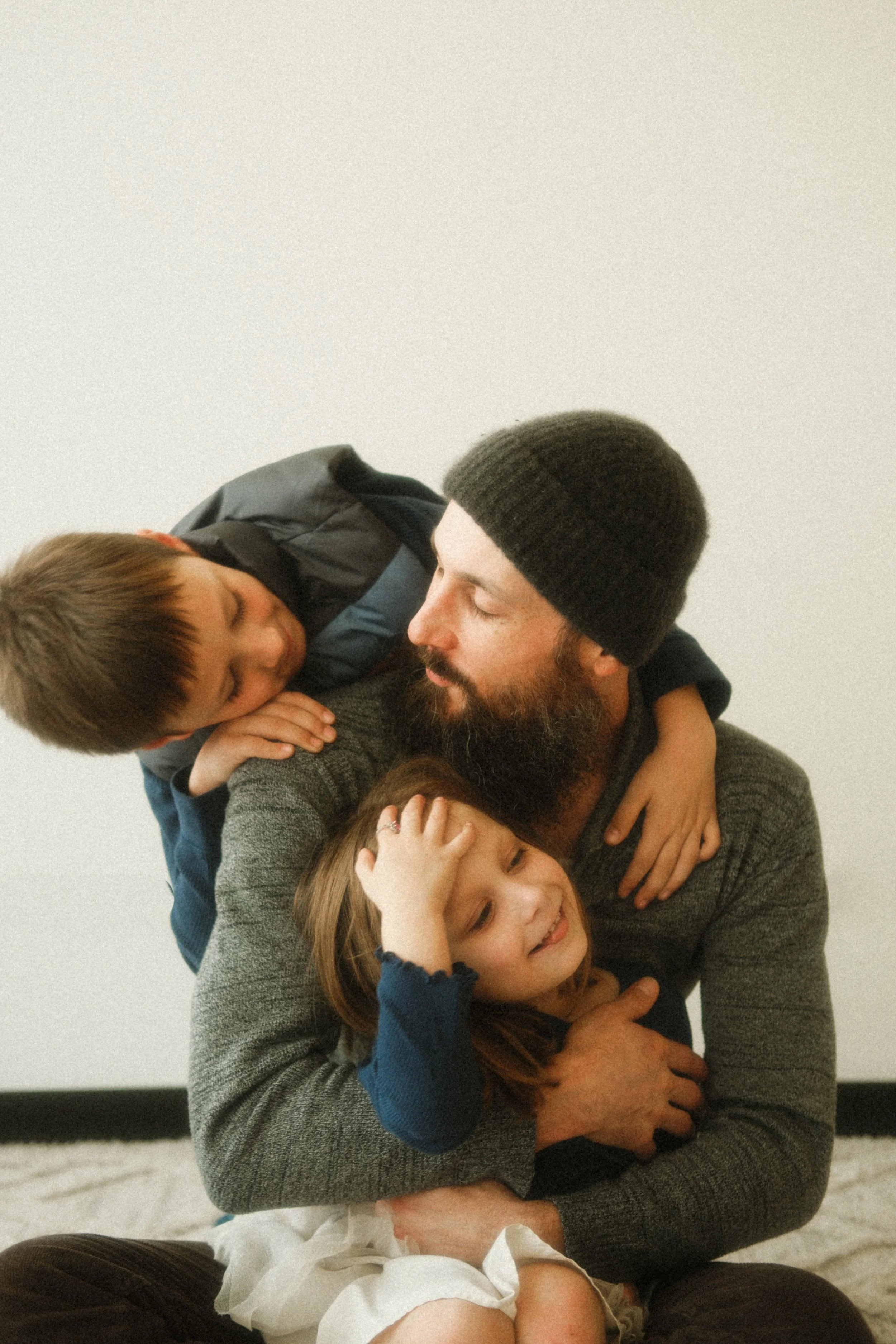 Dad and kids play together during family photos with Seattle family photographer.