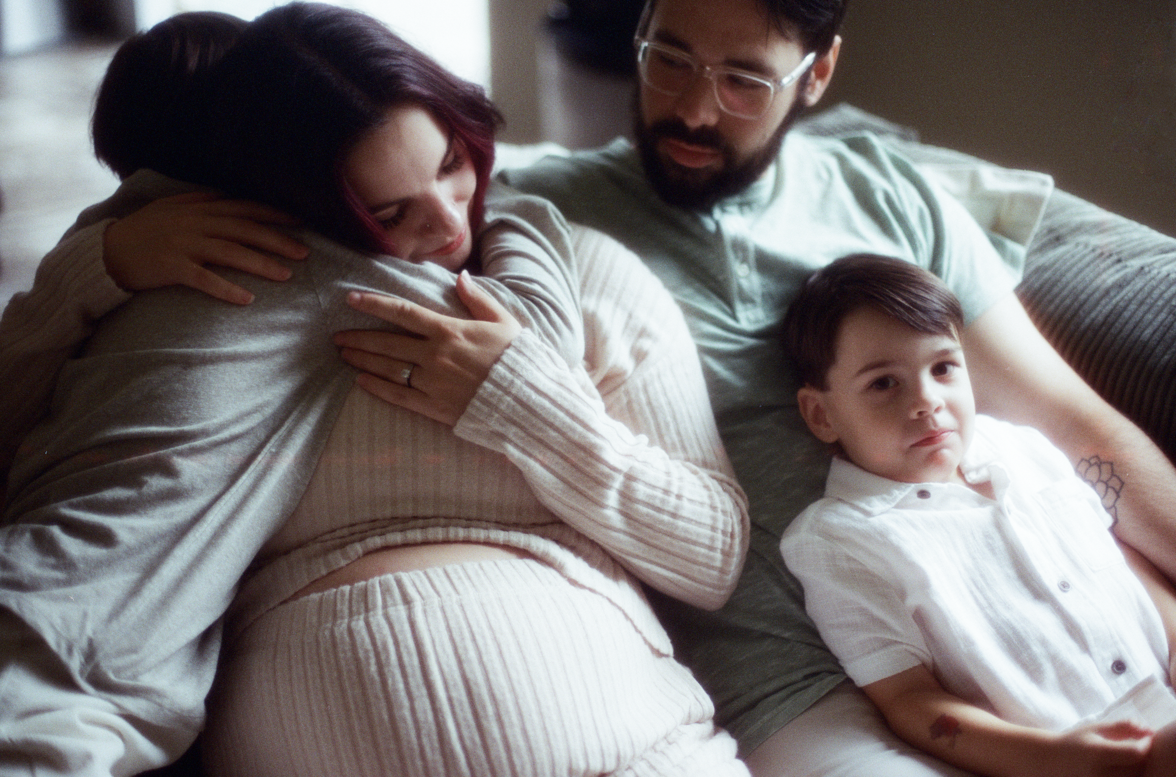 Tacoma expecting mom hugs her oldest son.