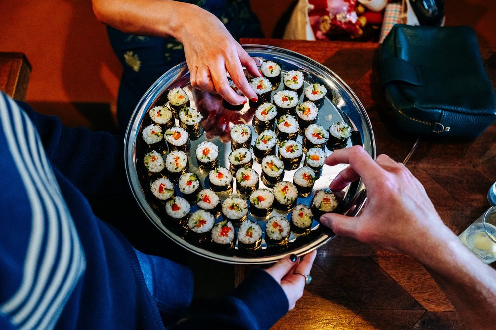 Guests helping themselves to canap&eacute;s