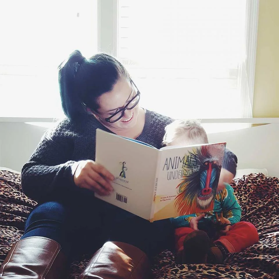 Mom Blogger Ayana Nell of "Little Prince Leopold" reading the book to her son (Photo Credit: Ayana Nell)