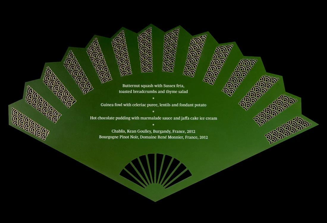 Laser-cut oriental fan menu for Madama Butterfly dinner at the Royal Opera House. Back.