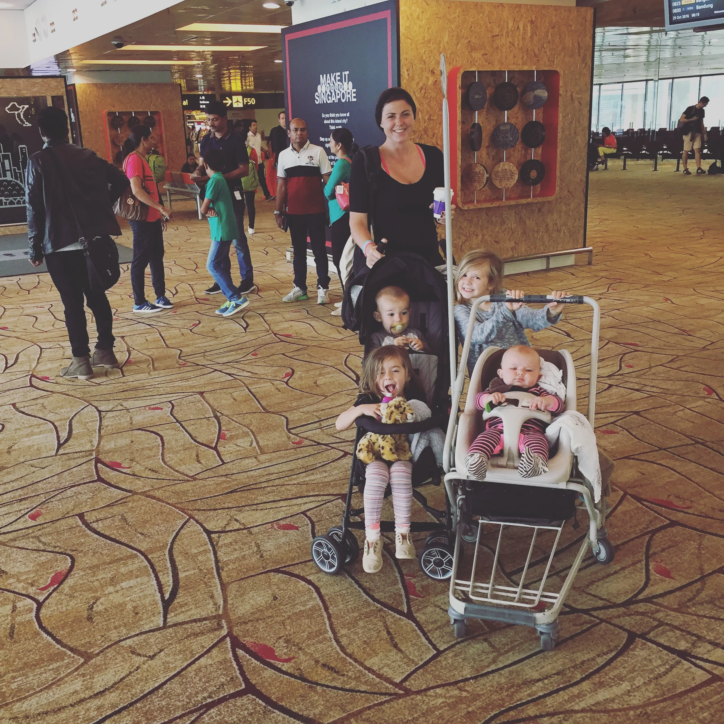 Complimentary loaner stroller in the Singapore airport and our double travel stroller is the Summer 3D Two. It folds up like a compact umbrella stroller and fits through the scanner at security. 