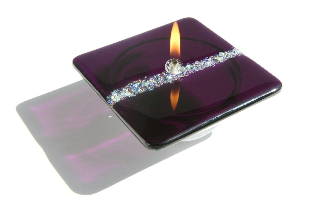 Some like it haute. You. Passionate. https://www.beaudoinjewelry.com/decor/purple-river-candle
.
#BeaudoinJewelry #candledecor #candles #handmadecandles #handcrafted  #wearableart #decor #bling #glassart #unique #jewelry #oillamp #artisan #glassjewel