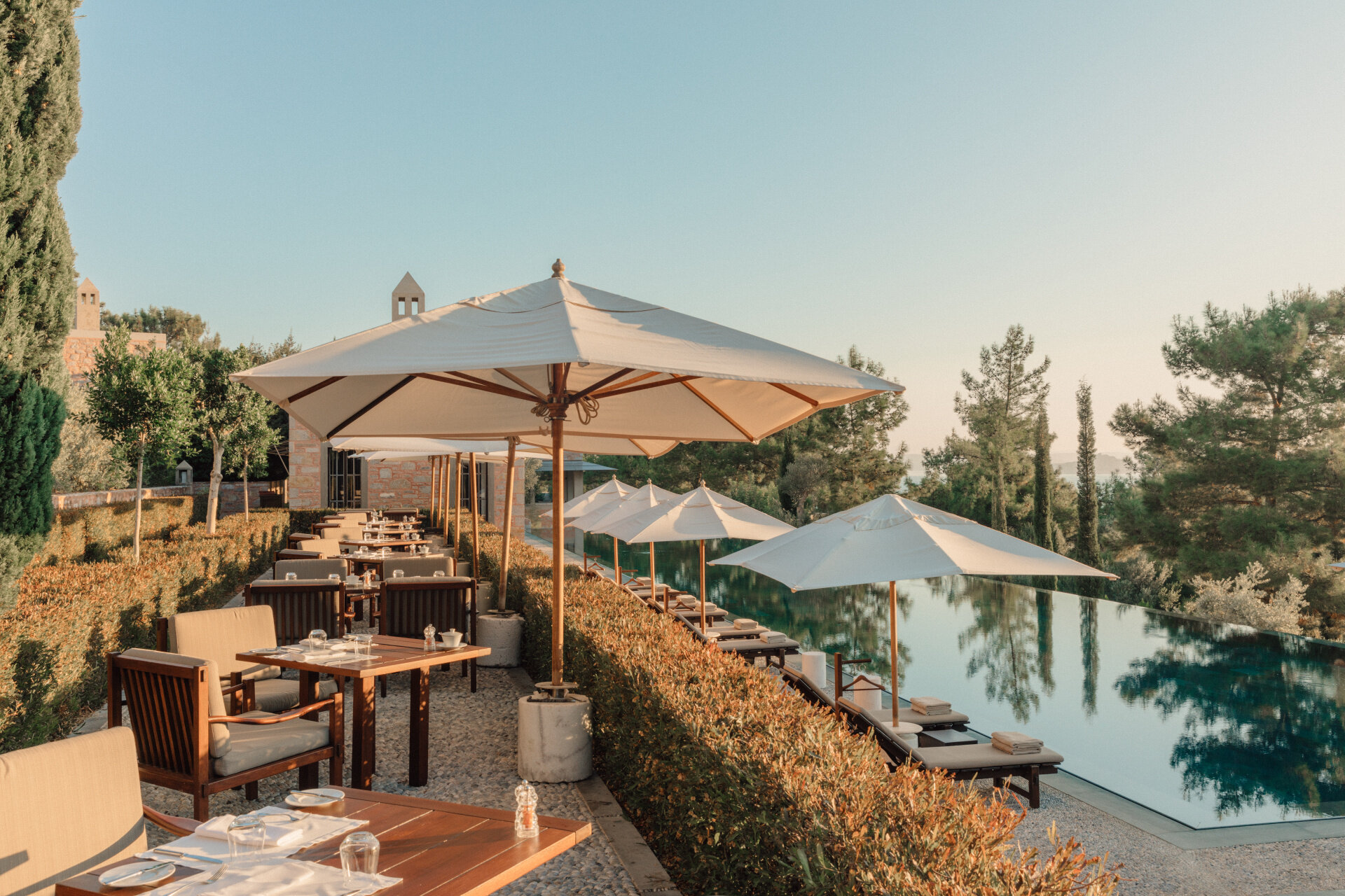   Dining by the pool (photo credit: Aman Hotels)  